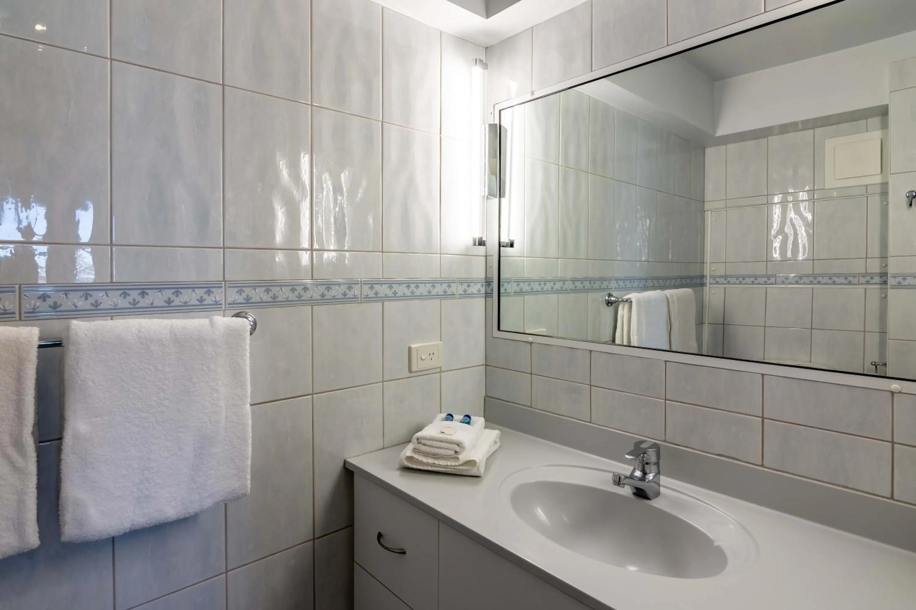 Bathroom in 84 The Spit Holiday Apartments