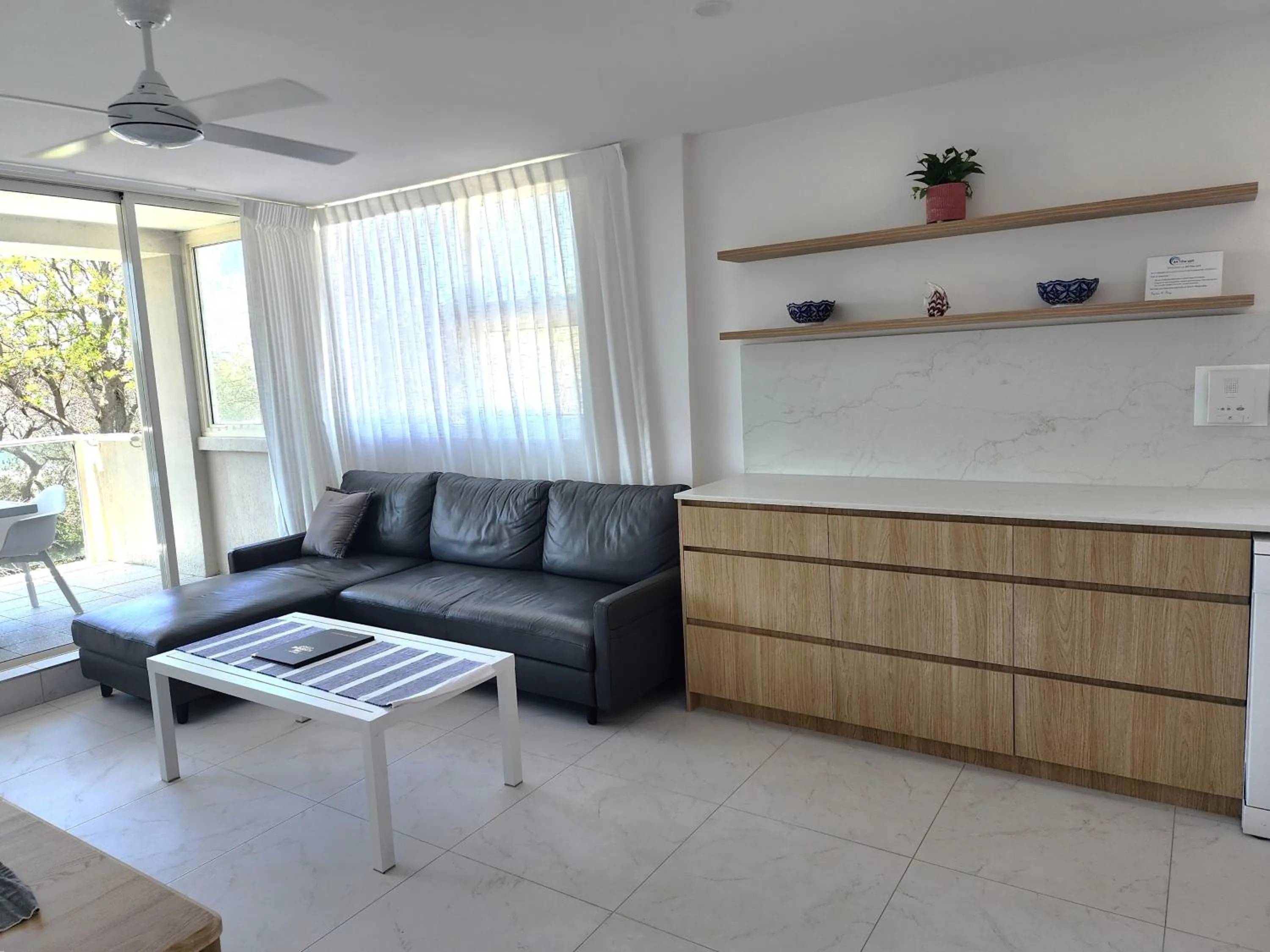 Living room in 84 The Spit Holiday Apartments