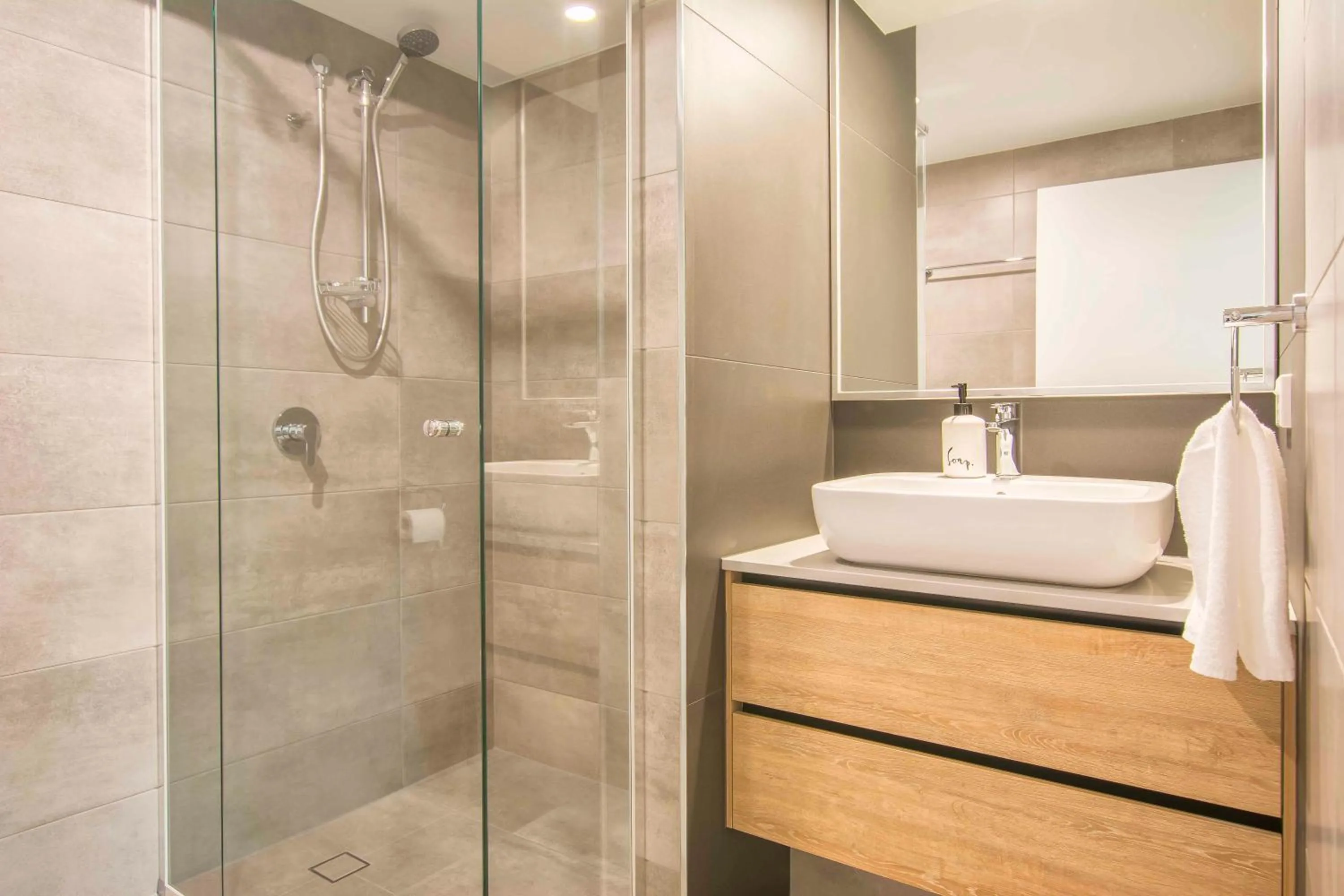 Bathroom in 84 The Spit Holiday Apartments