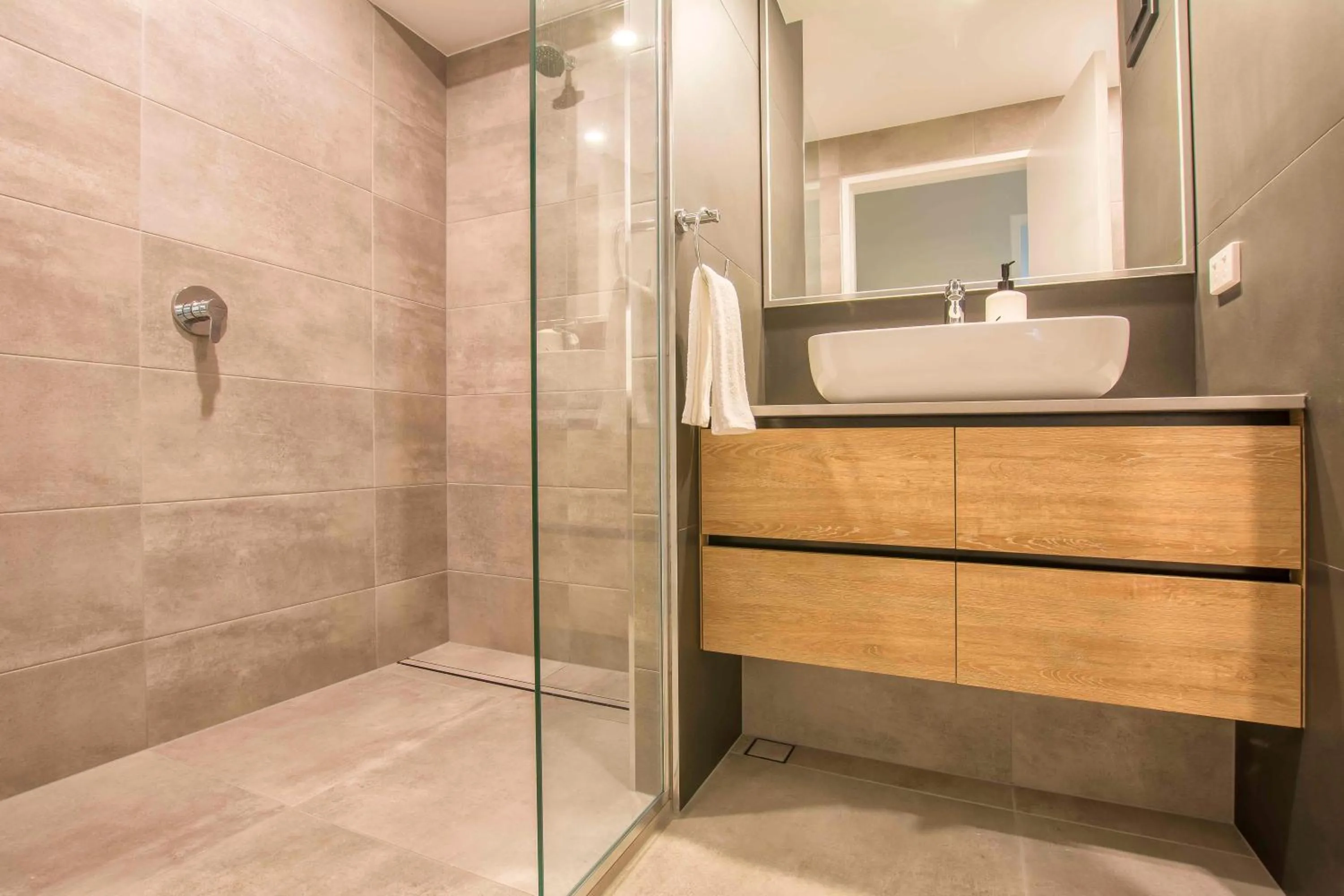 Bathroom in 84 The Spit Holiday Apartments