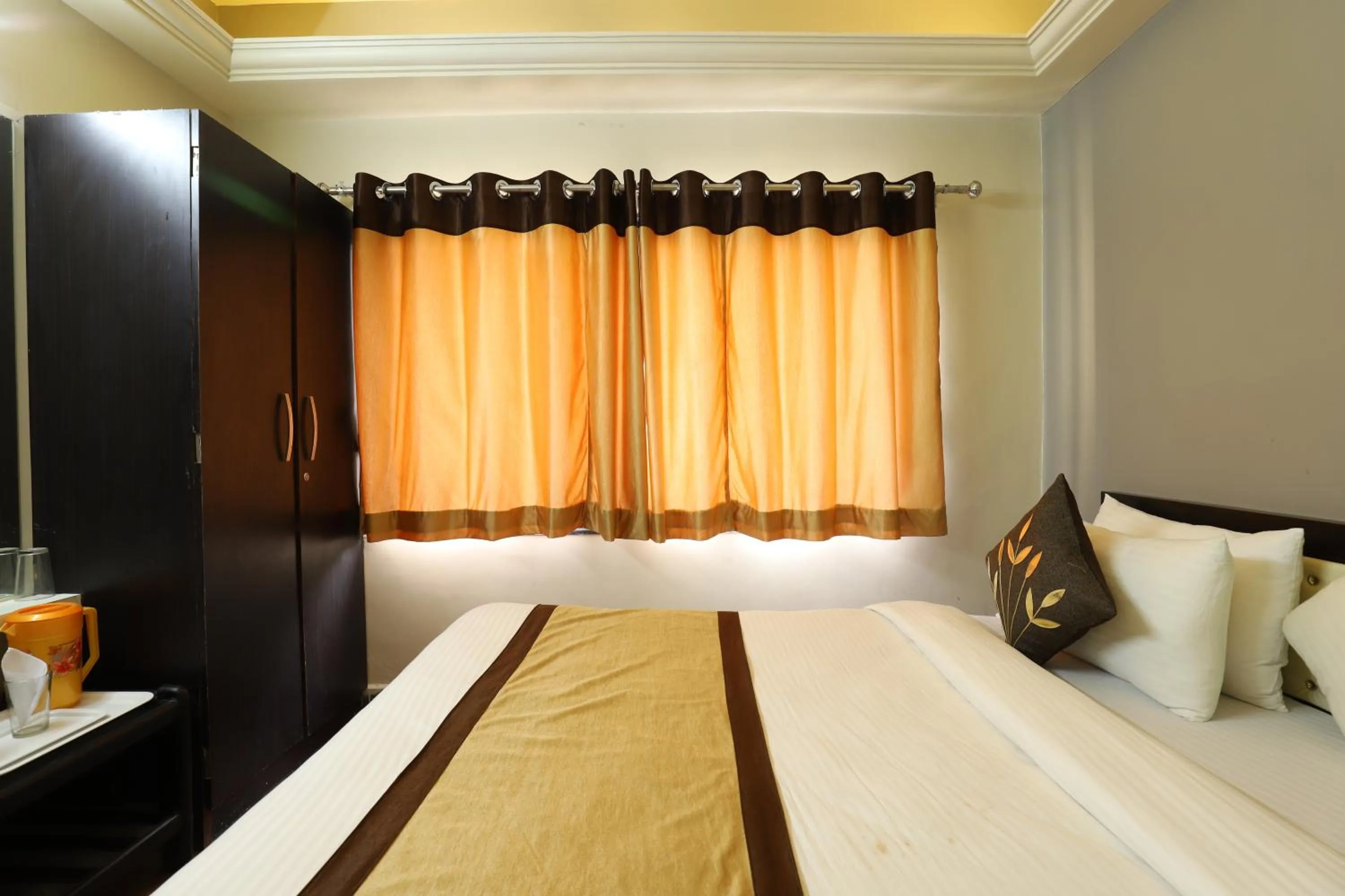 Bed in Hotel Loyal Residency