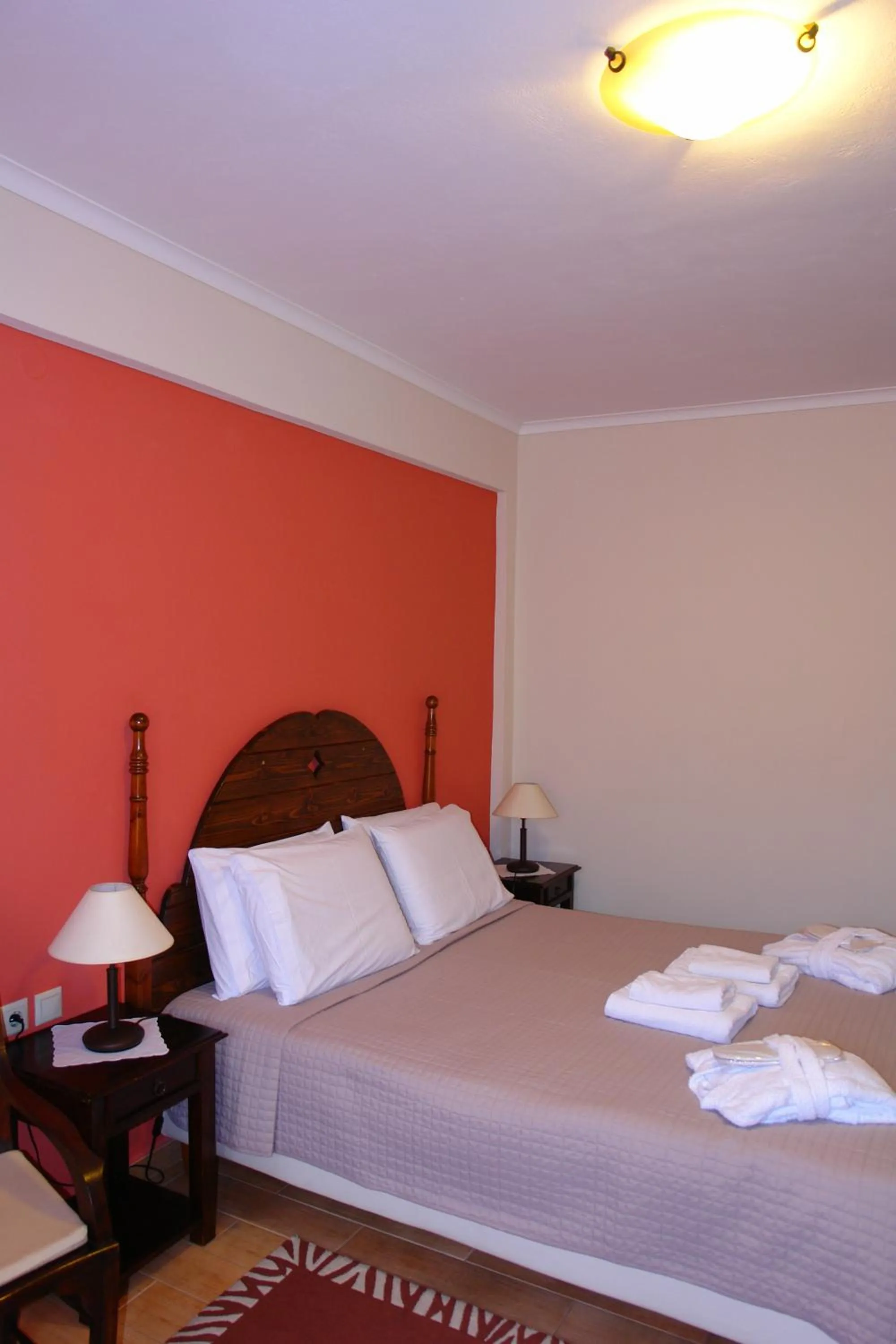 Bed in Melegos Inn Hotel