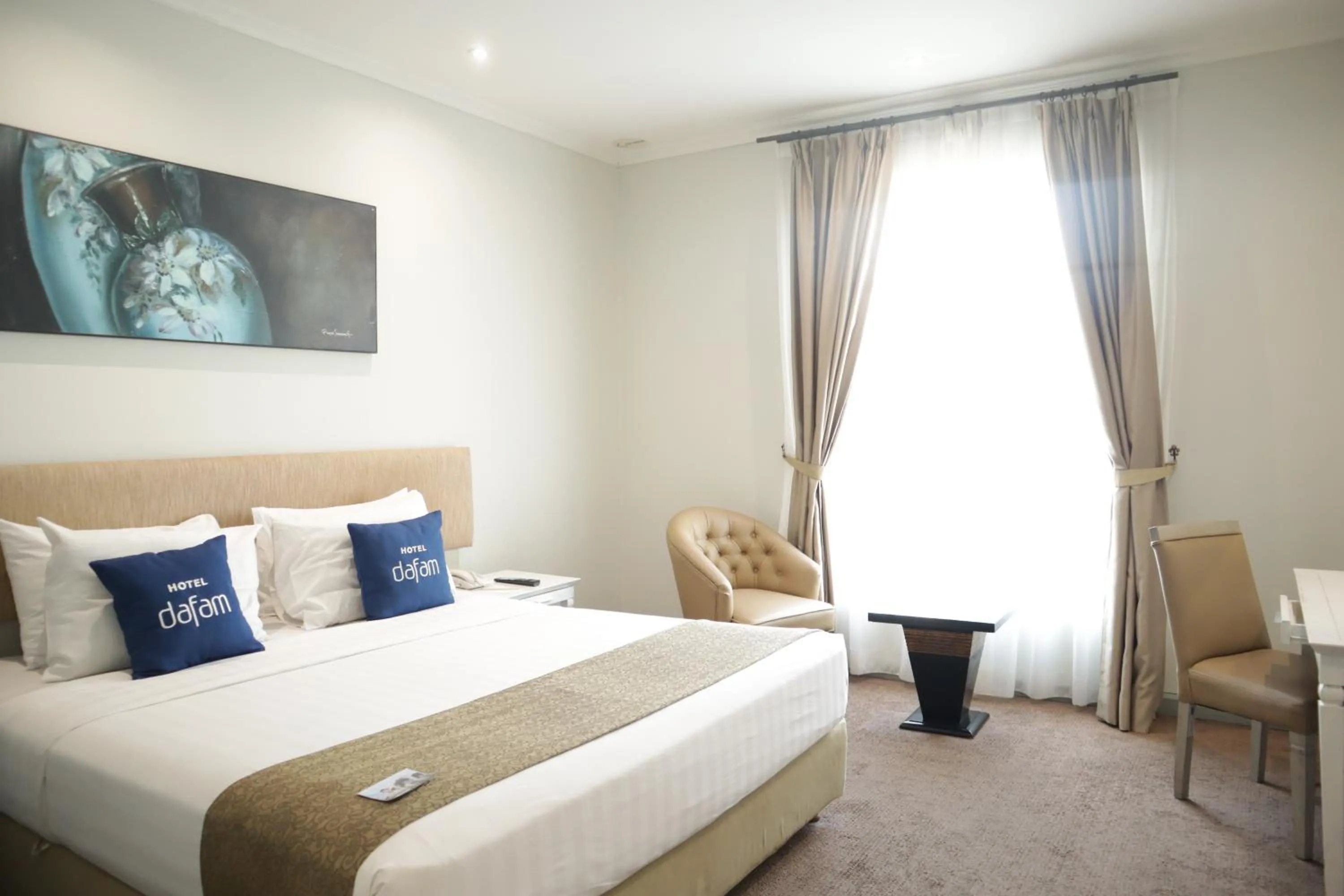 Bed in Hotel Dafam Semarang