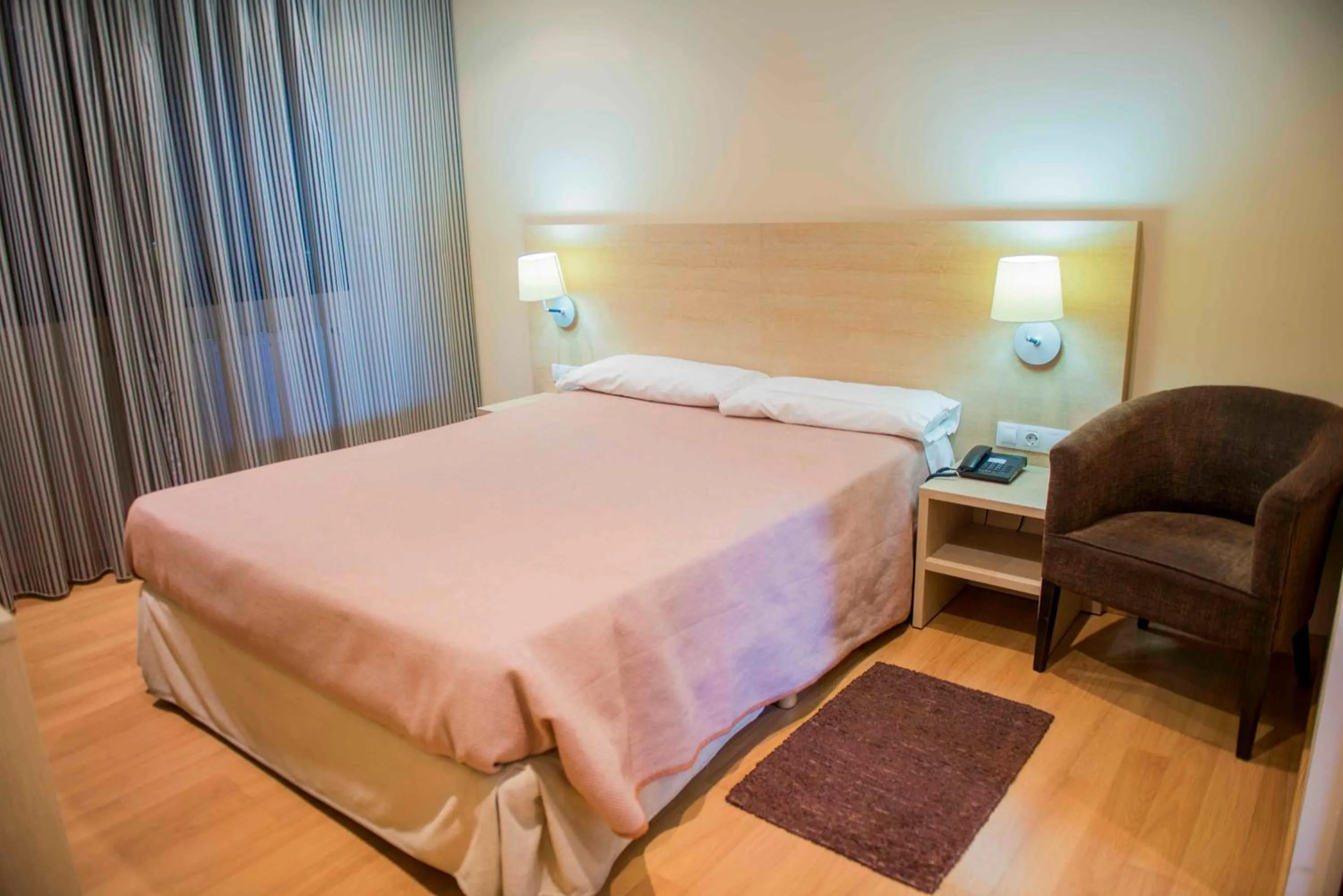 Bed in Hotel Meson de Erosa