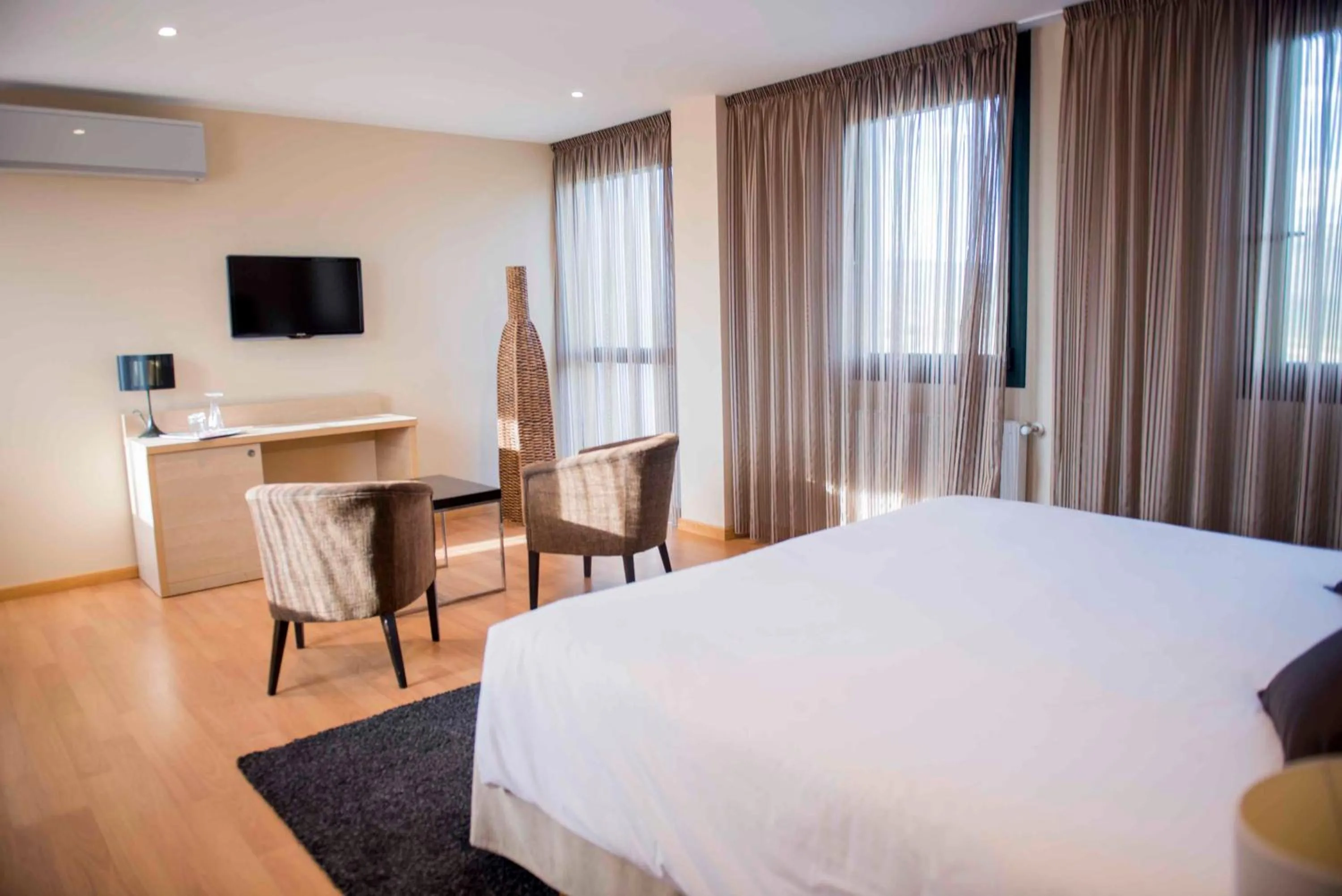 Bed in Hotel Meson de Erosa