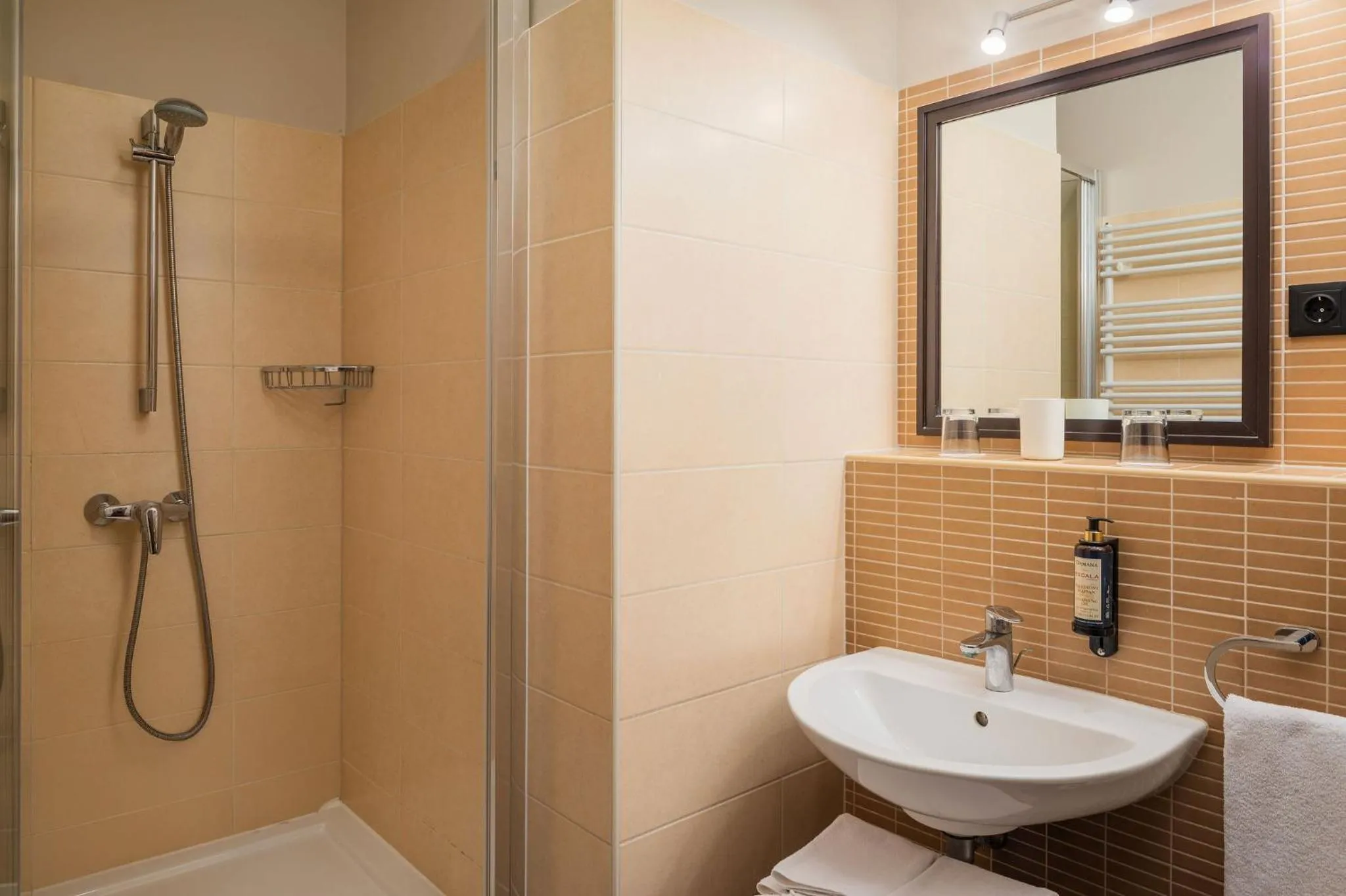 Shower in Escala Hotel & Suites