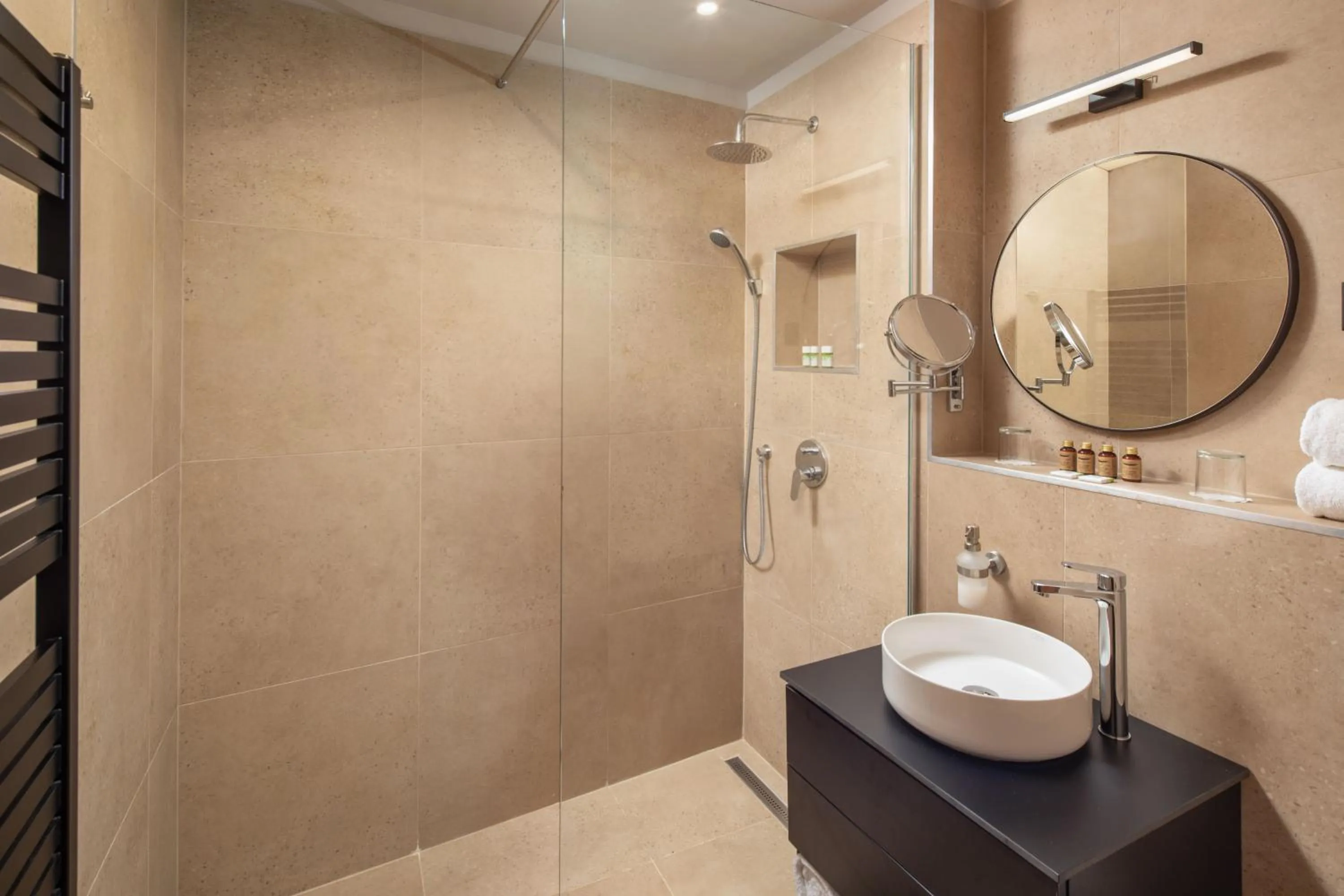 Shower in Escala Hotel & Suites