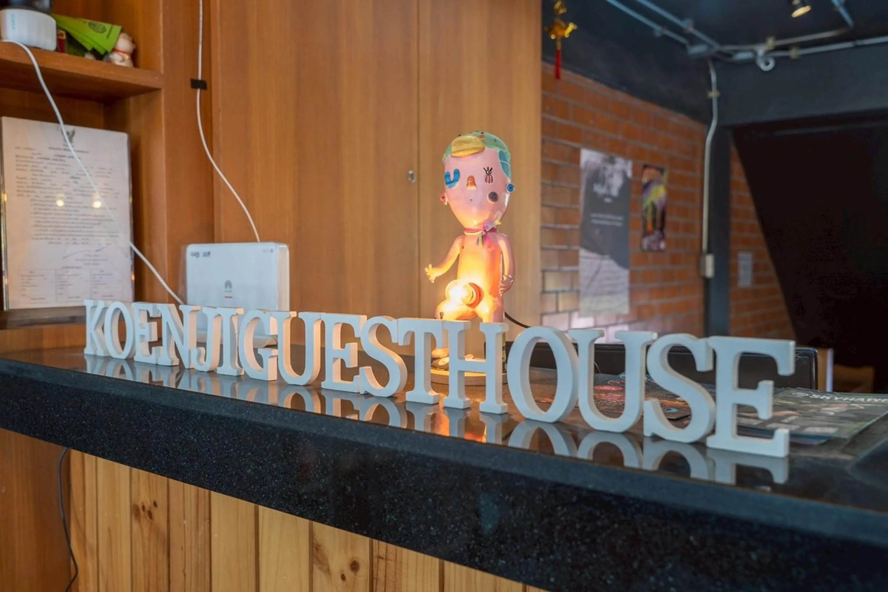 Text overlay in Koenji Guest House & Bar Chiang Mai