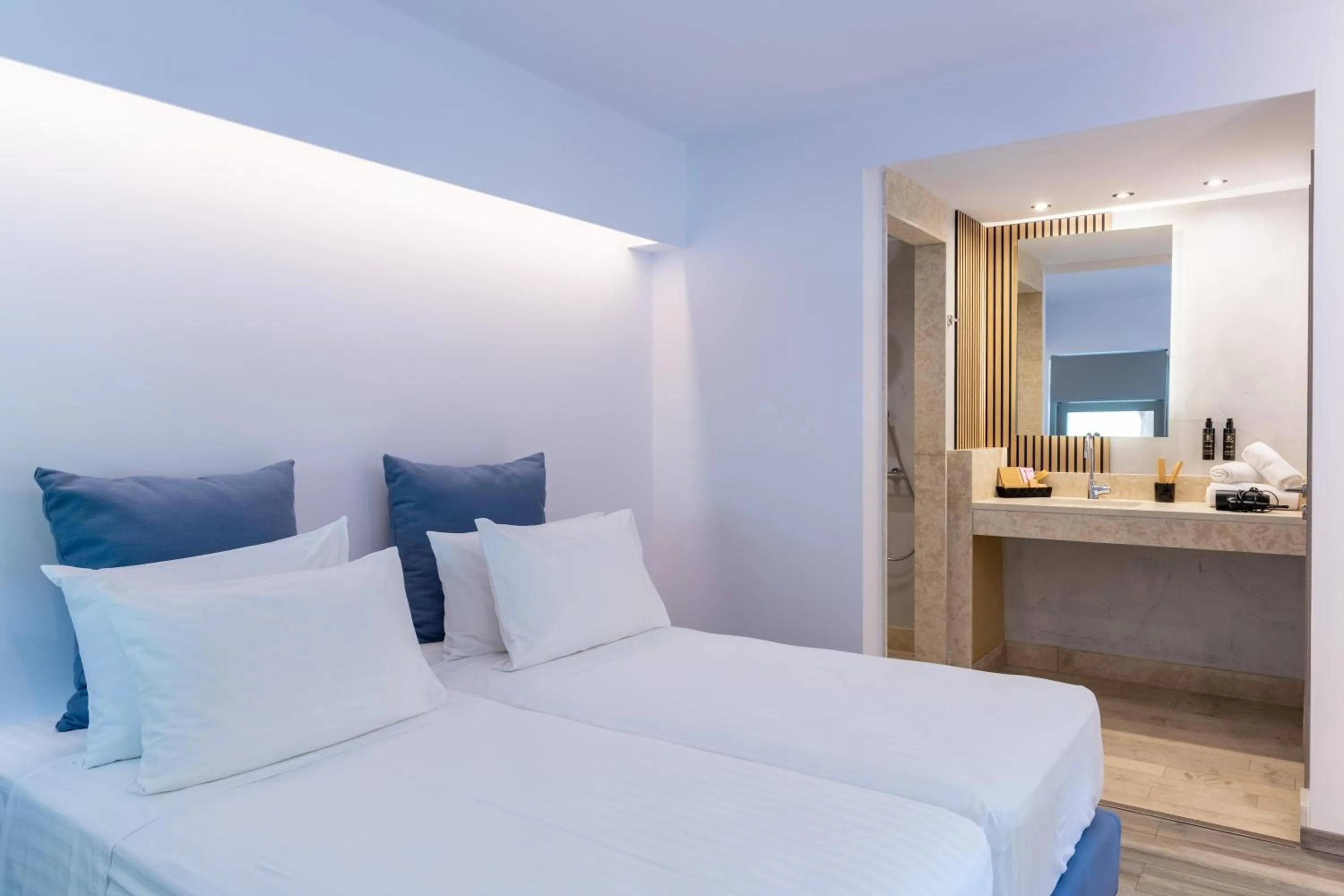 Bed in Civitel Attik Rooms & Suites