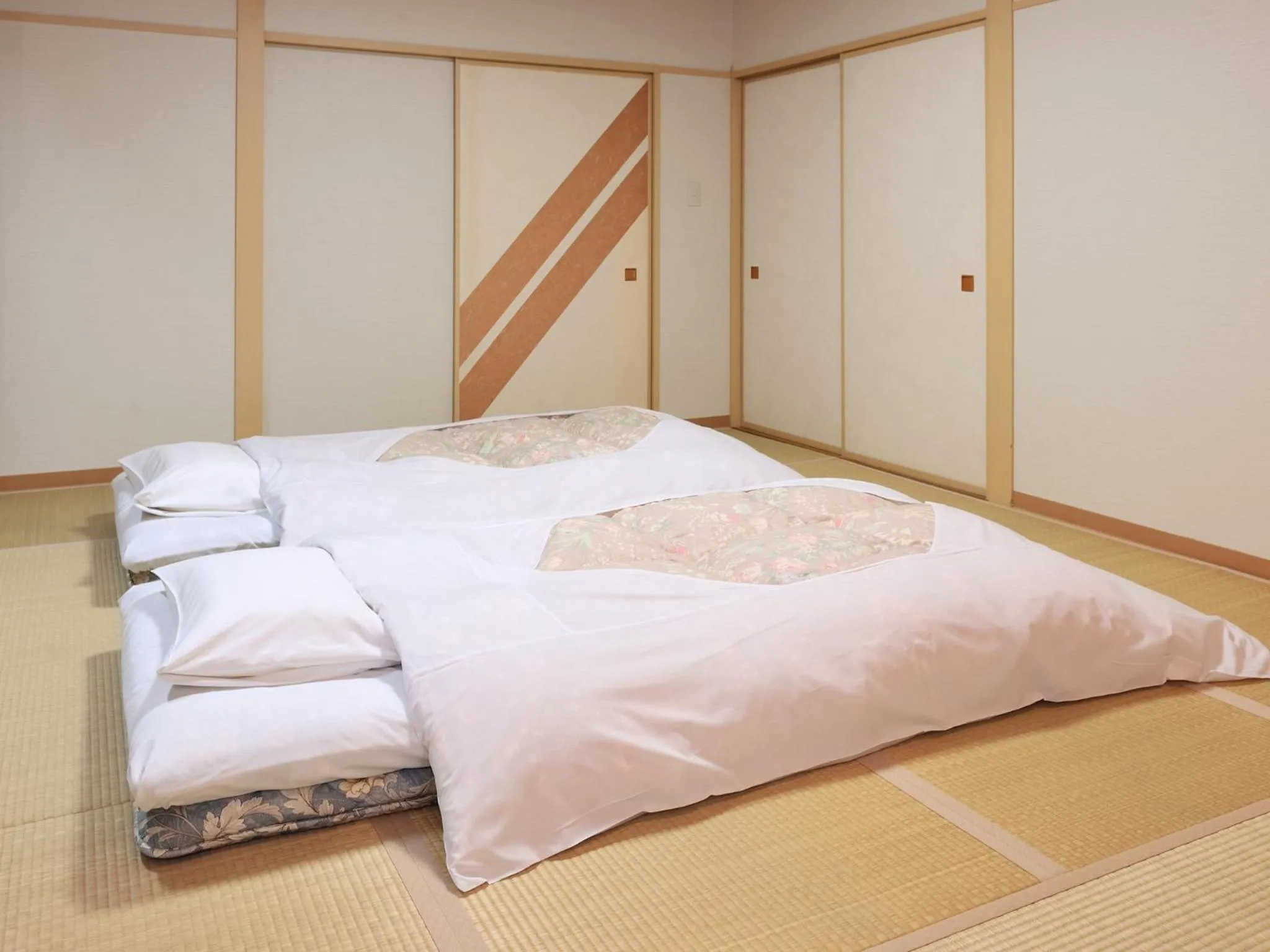 Bed in Hotel Tsubakino