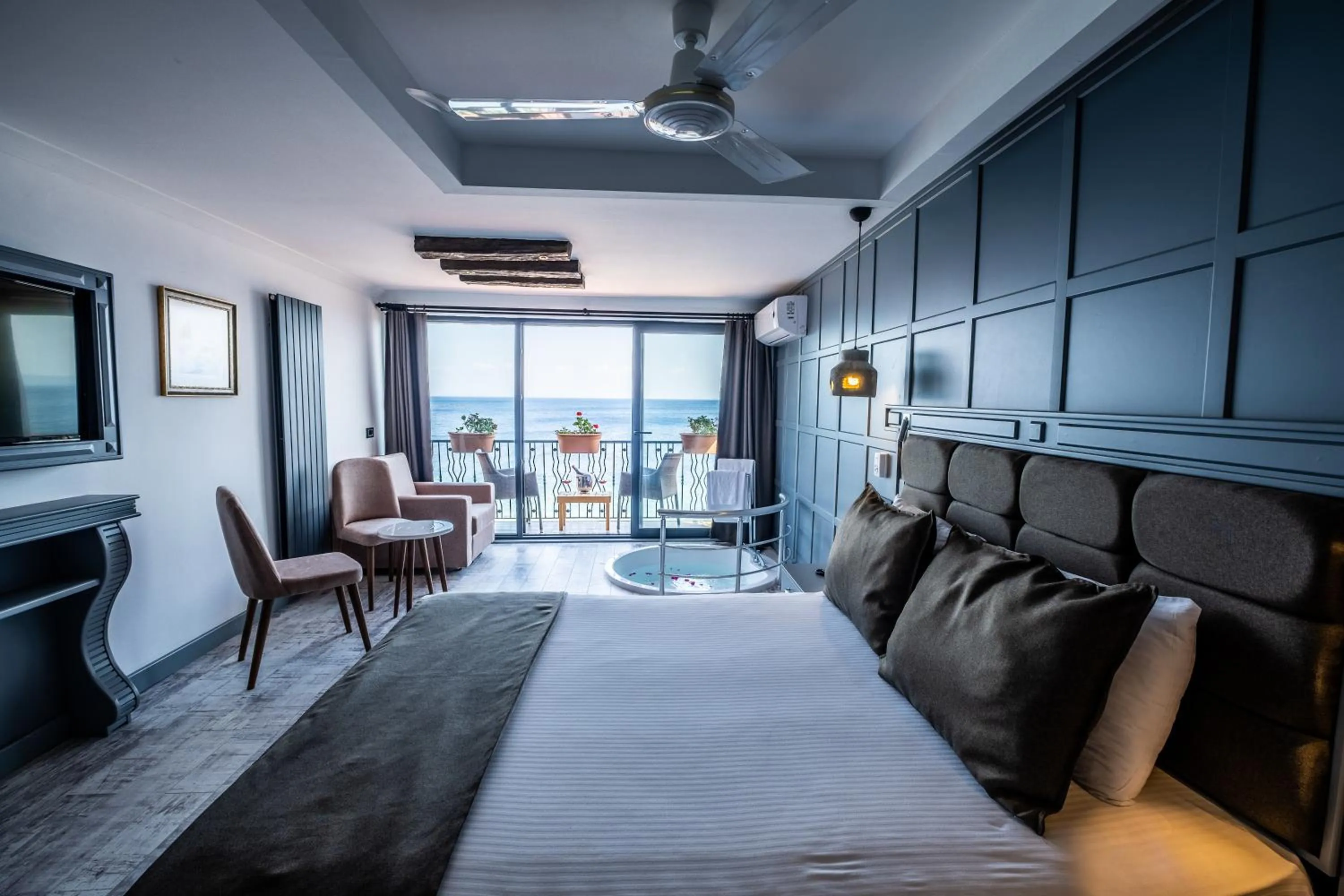 Photo of the whole room, Bed in Assos Kervansaray Hotel - Special Category