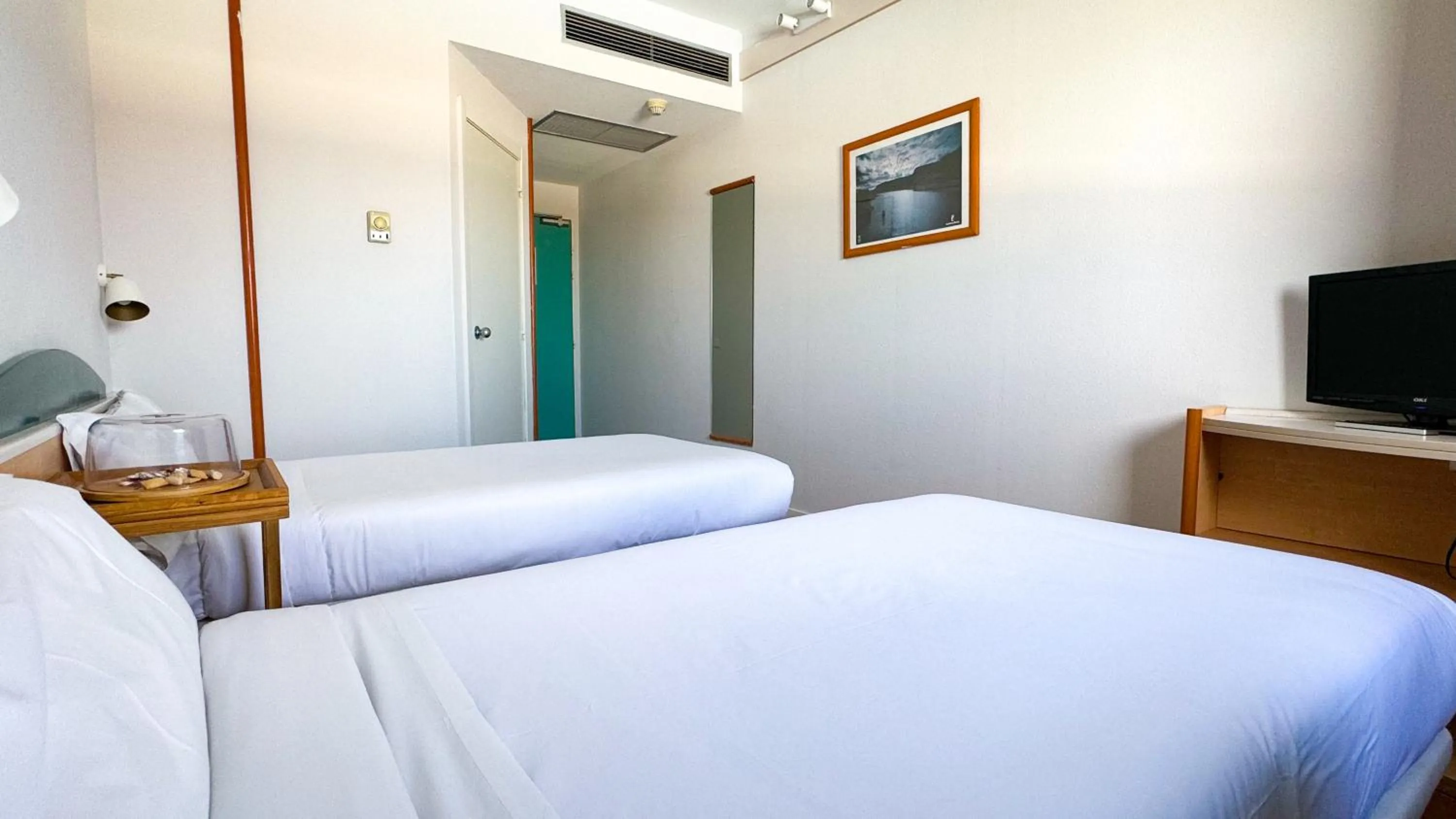 Bed in Hotel Iris Guadalajara