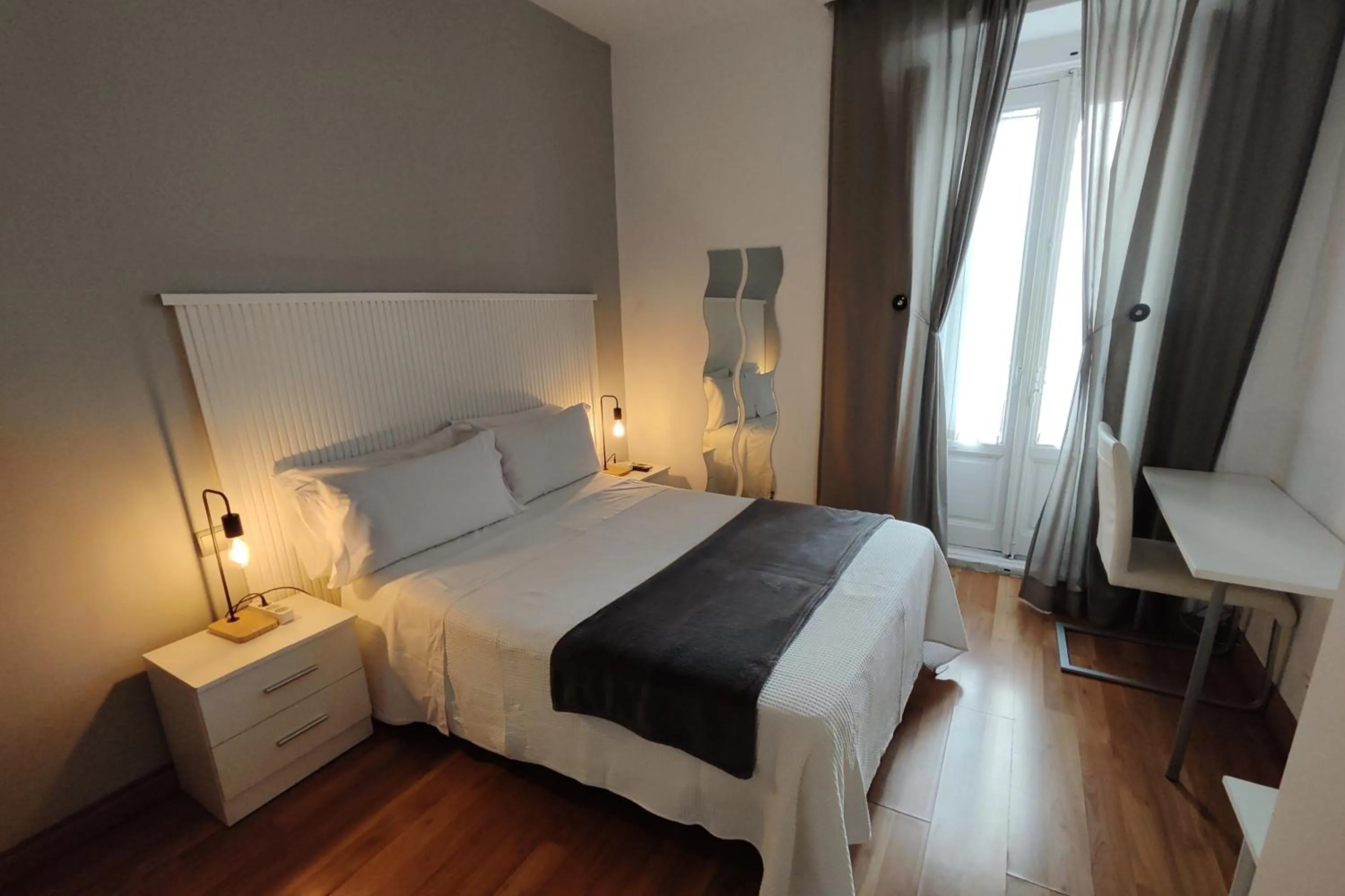 Photo of the whole room, Bed in Hostal Cervantes