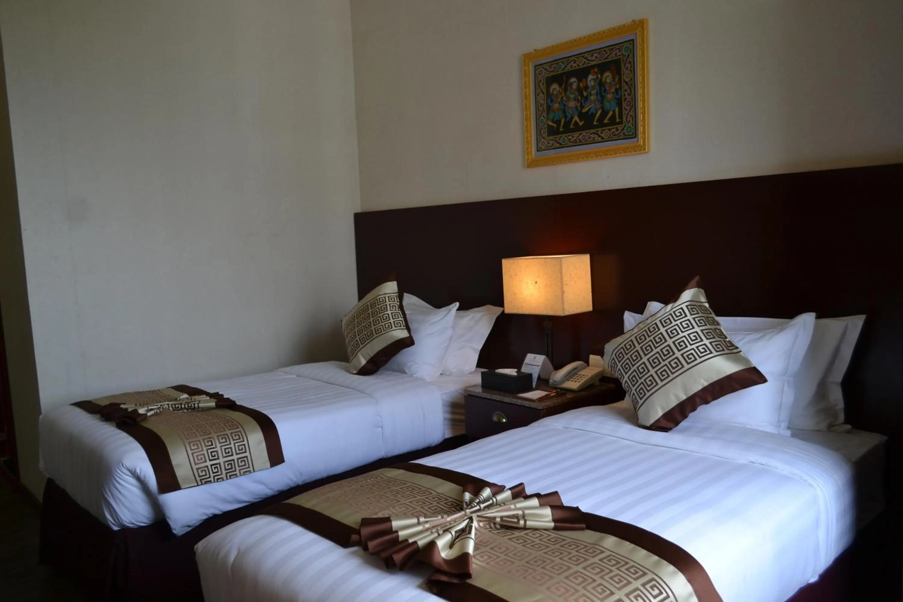 Bed in Hotel Broadway Yangon