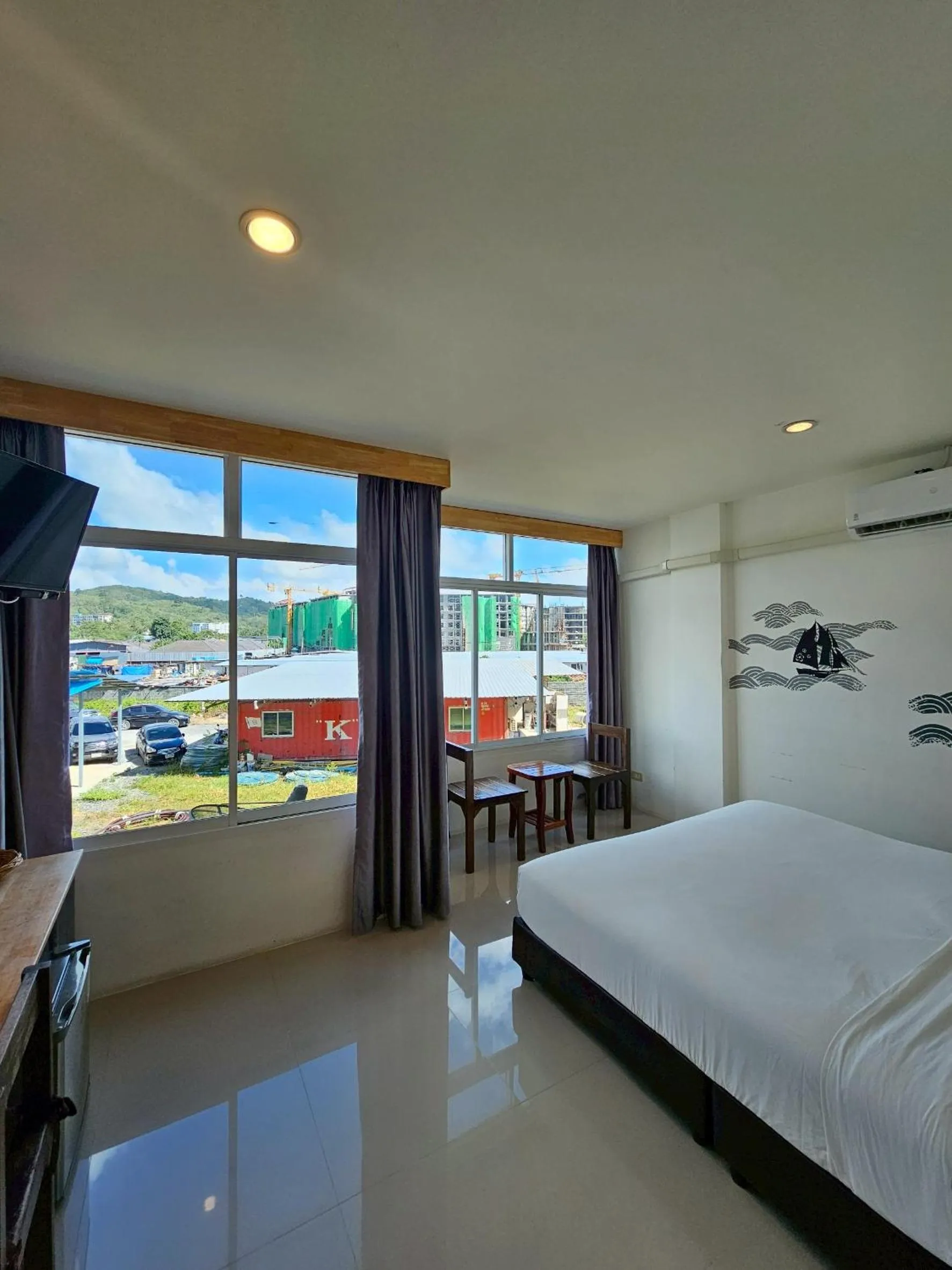 Bed in Dwell Phuket Airport Hotel at Naiyang