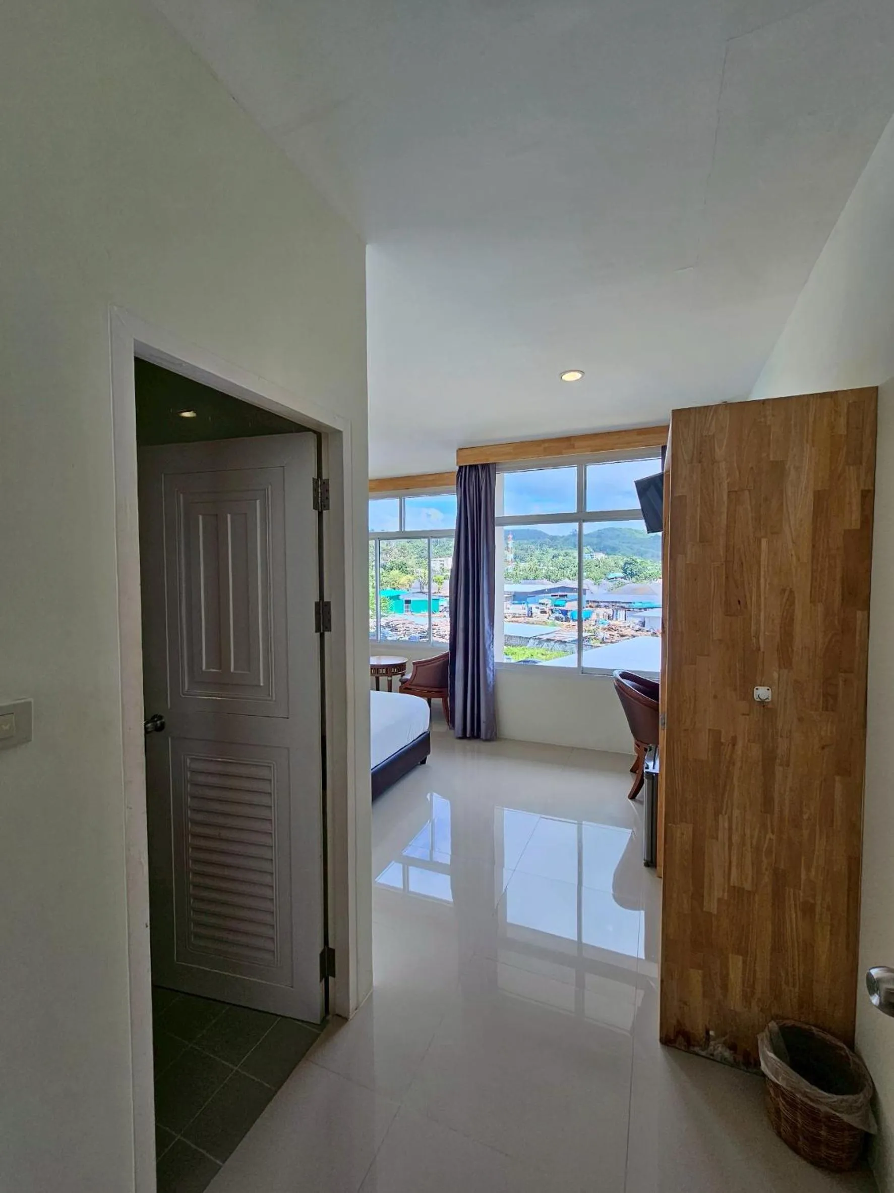 Bed in Dwell Phuket Airport Hotel at Naiyang