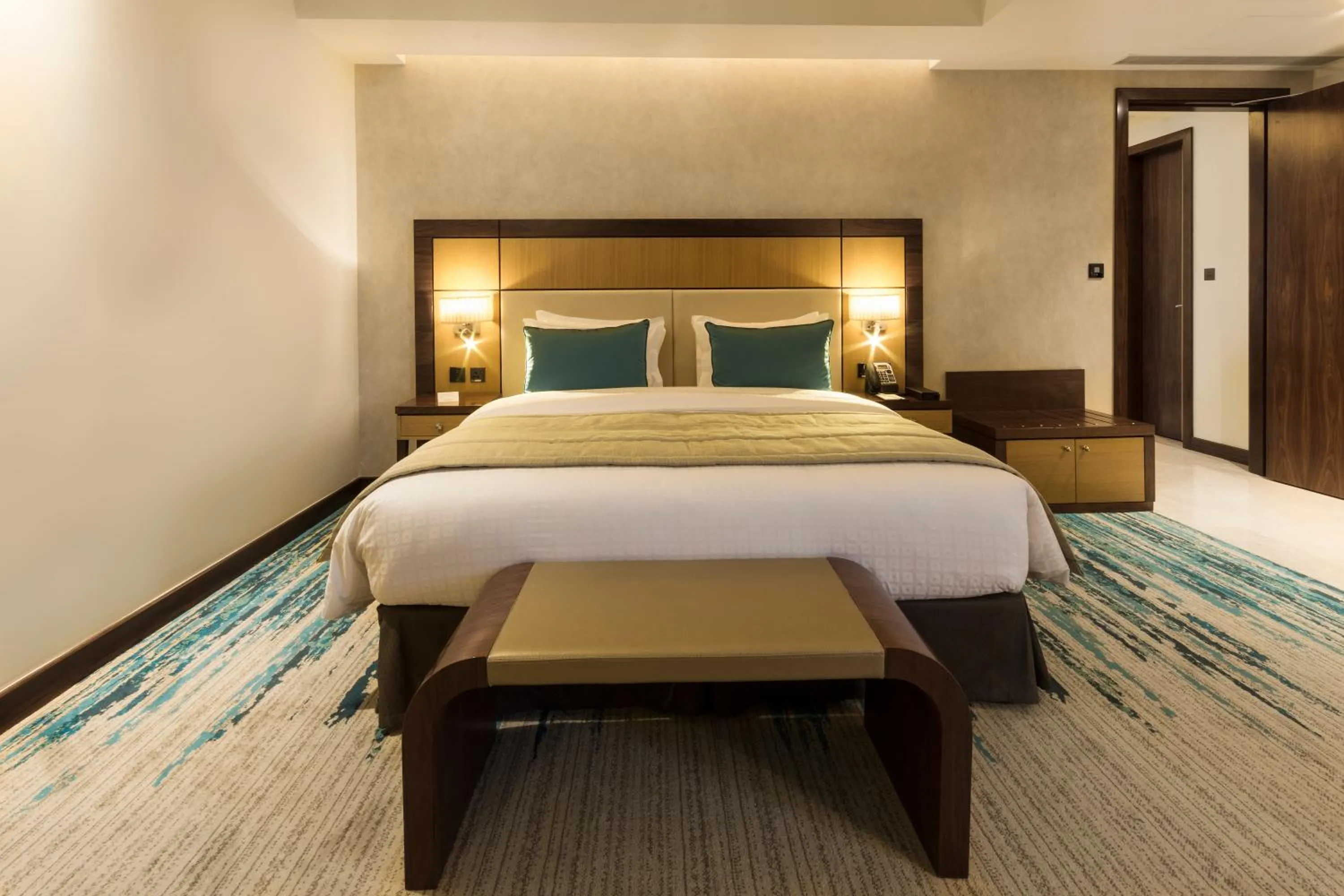 Bed in Golden Tulip Media Hotel