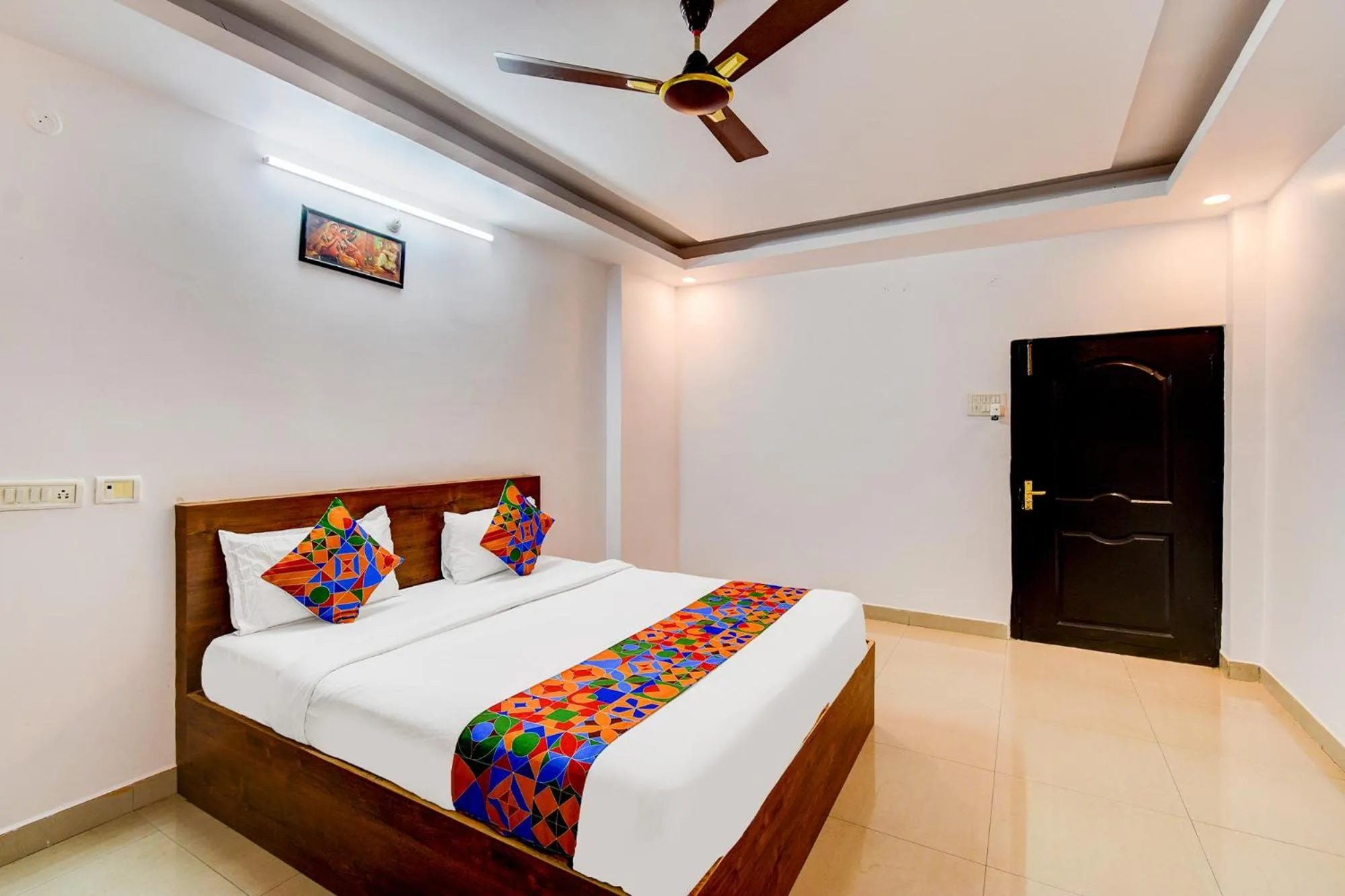 Bed in FabHotel Pushpa Grand