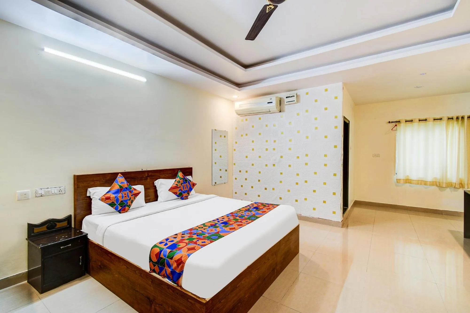 Bed in FabHotel Pushpa Grand
