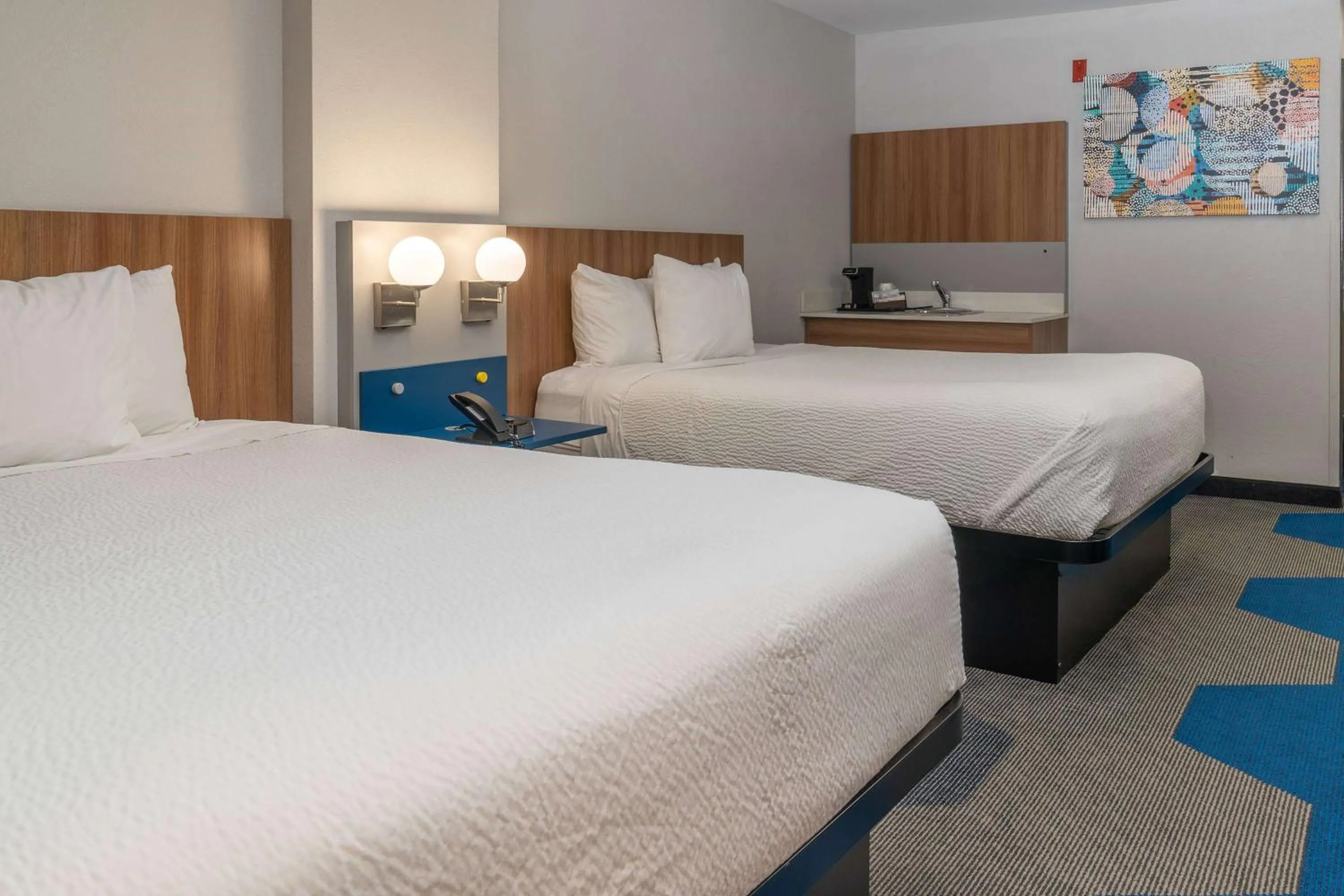 Bed in Microtel Inn & Suites by Wyndham Pigeon Forge