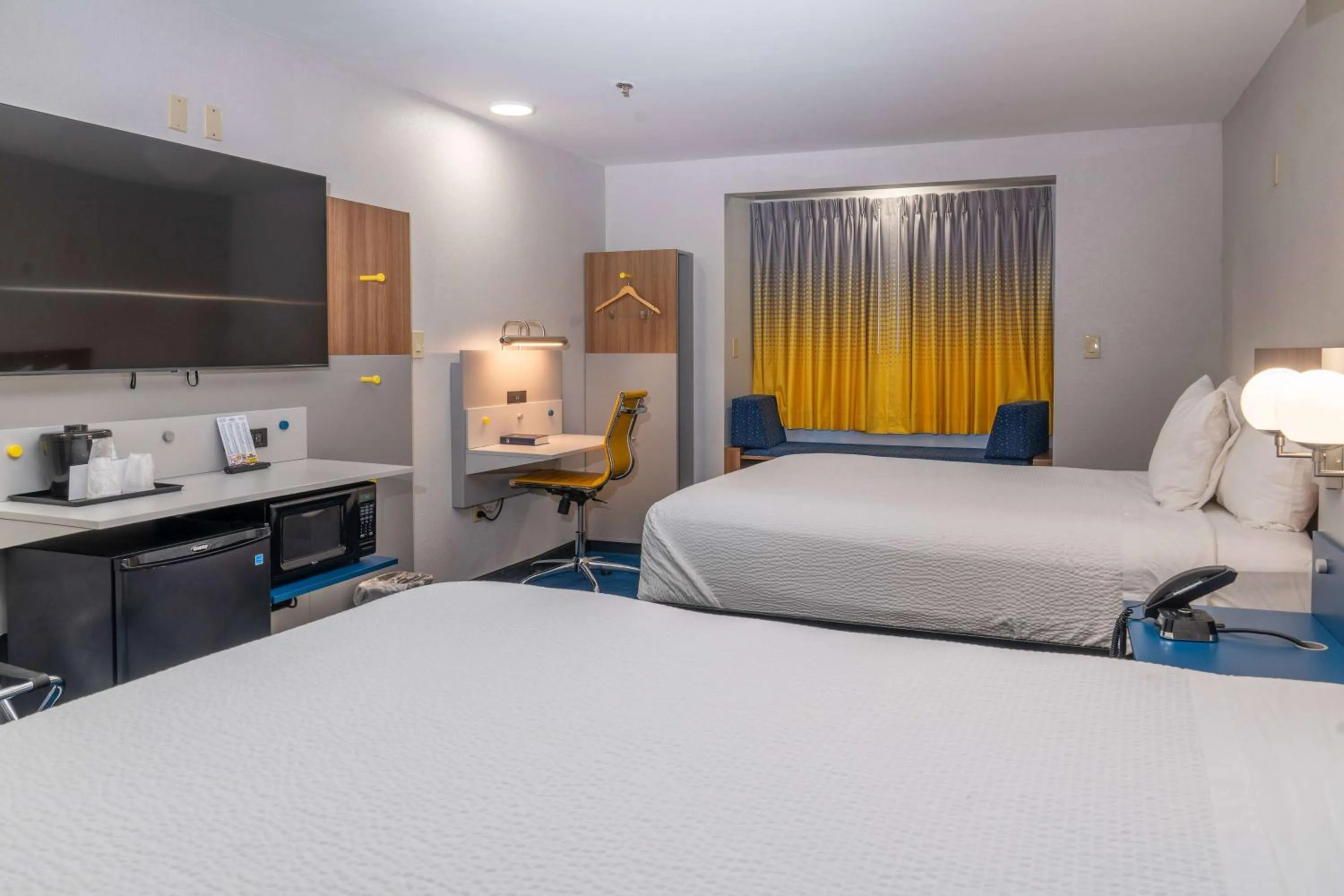 Bed in Microtel Inn & Suites by Wyndham Pigeon Forge