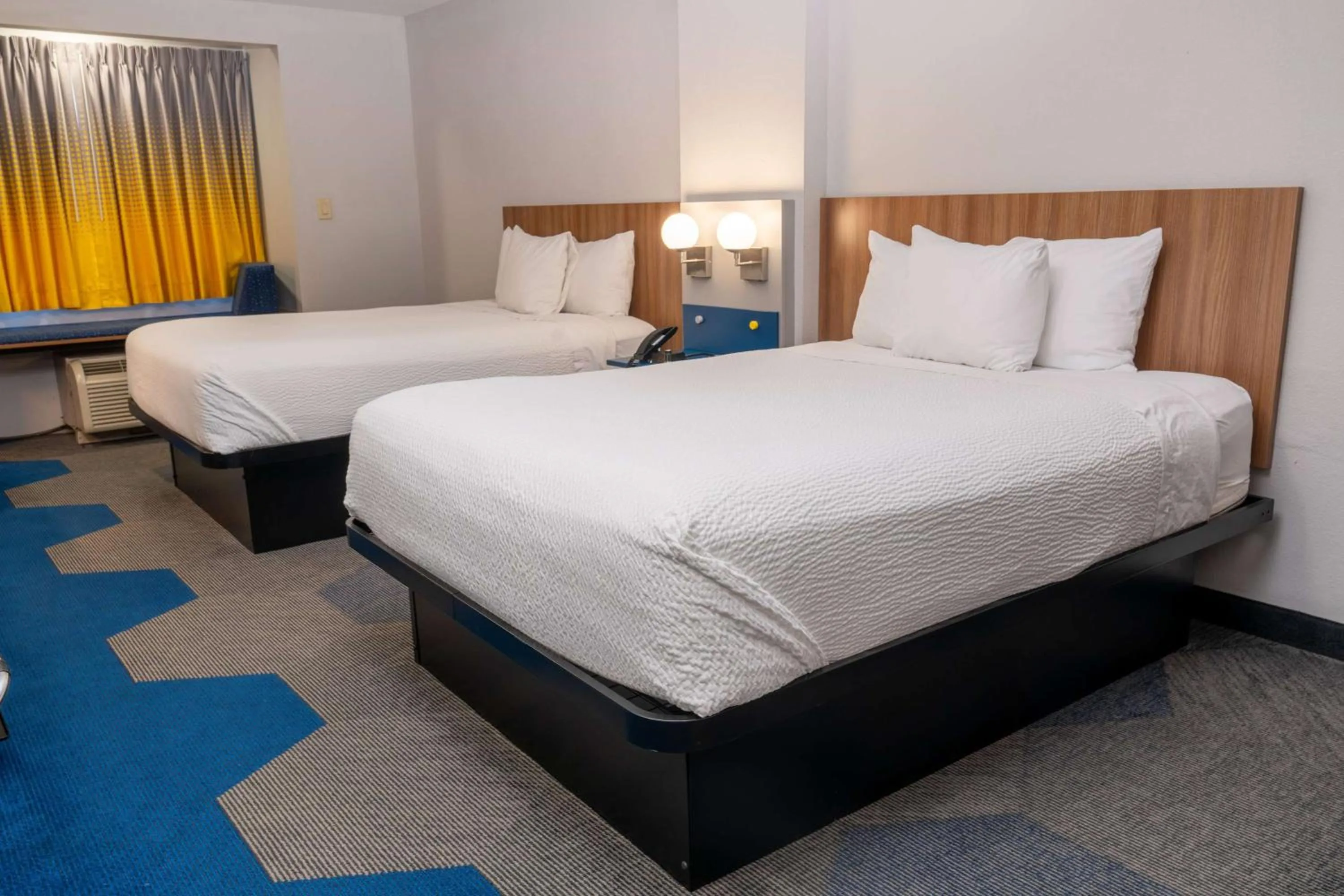 Bed in Microtel Inn & Suites by Wyndham Pigeon Forge