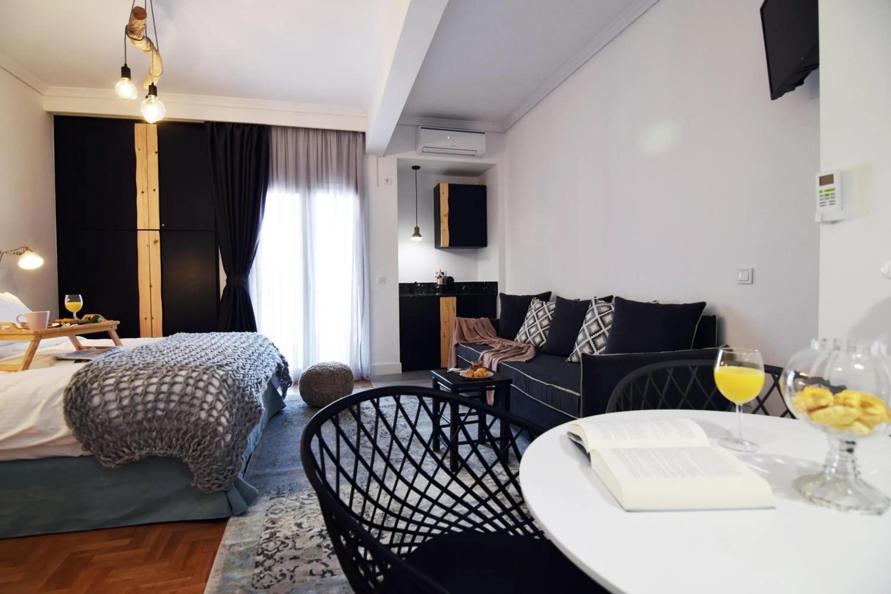 Bed in Grey Studios by Skg Apartments