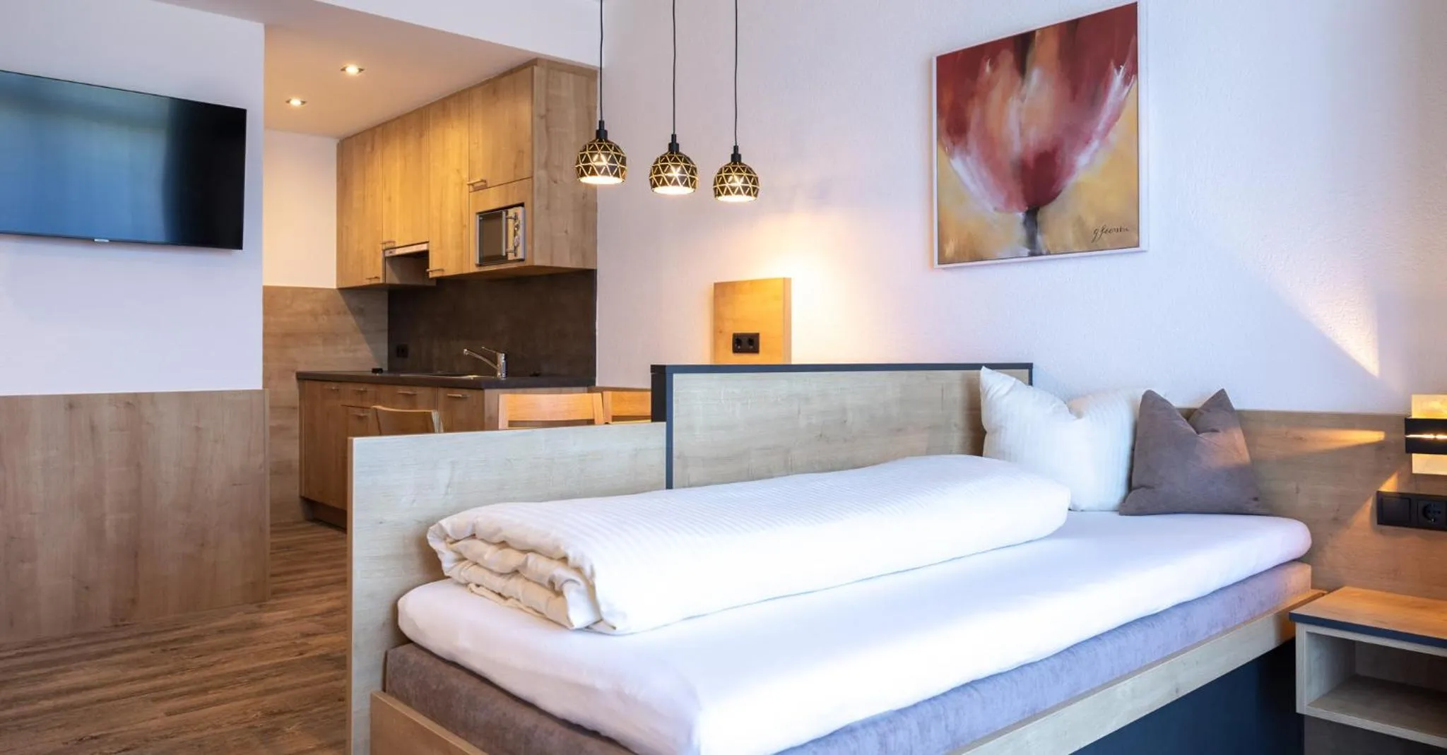 Bed in Das Aparthotel Olympia Tirol