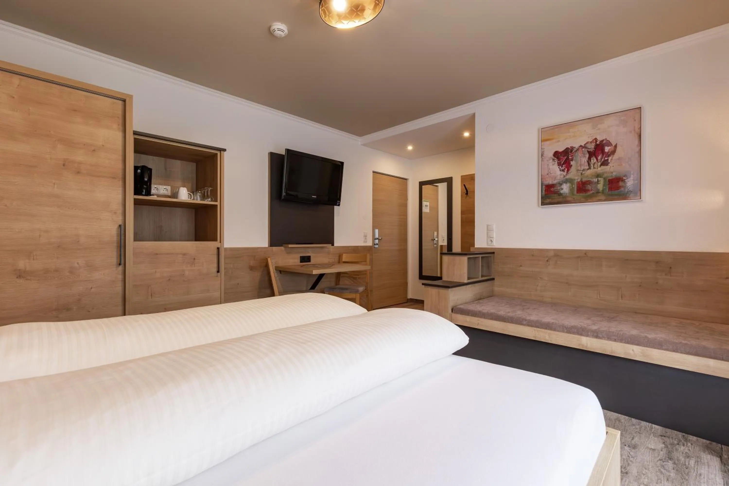 Bed in Das Aparthotel Olympia Tirol