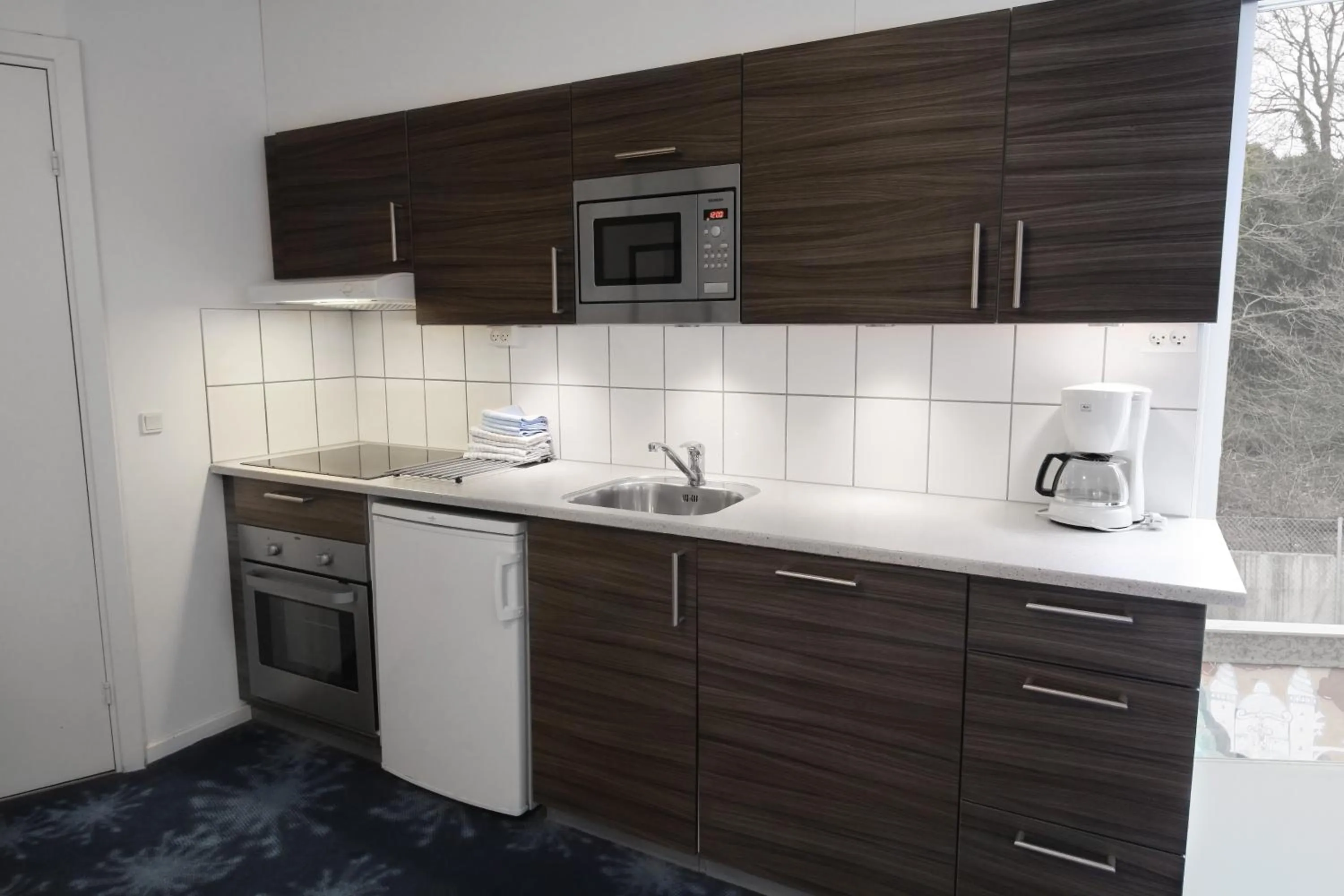 Kitchen or kitchenette in ApartHotel Faber