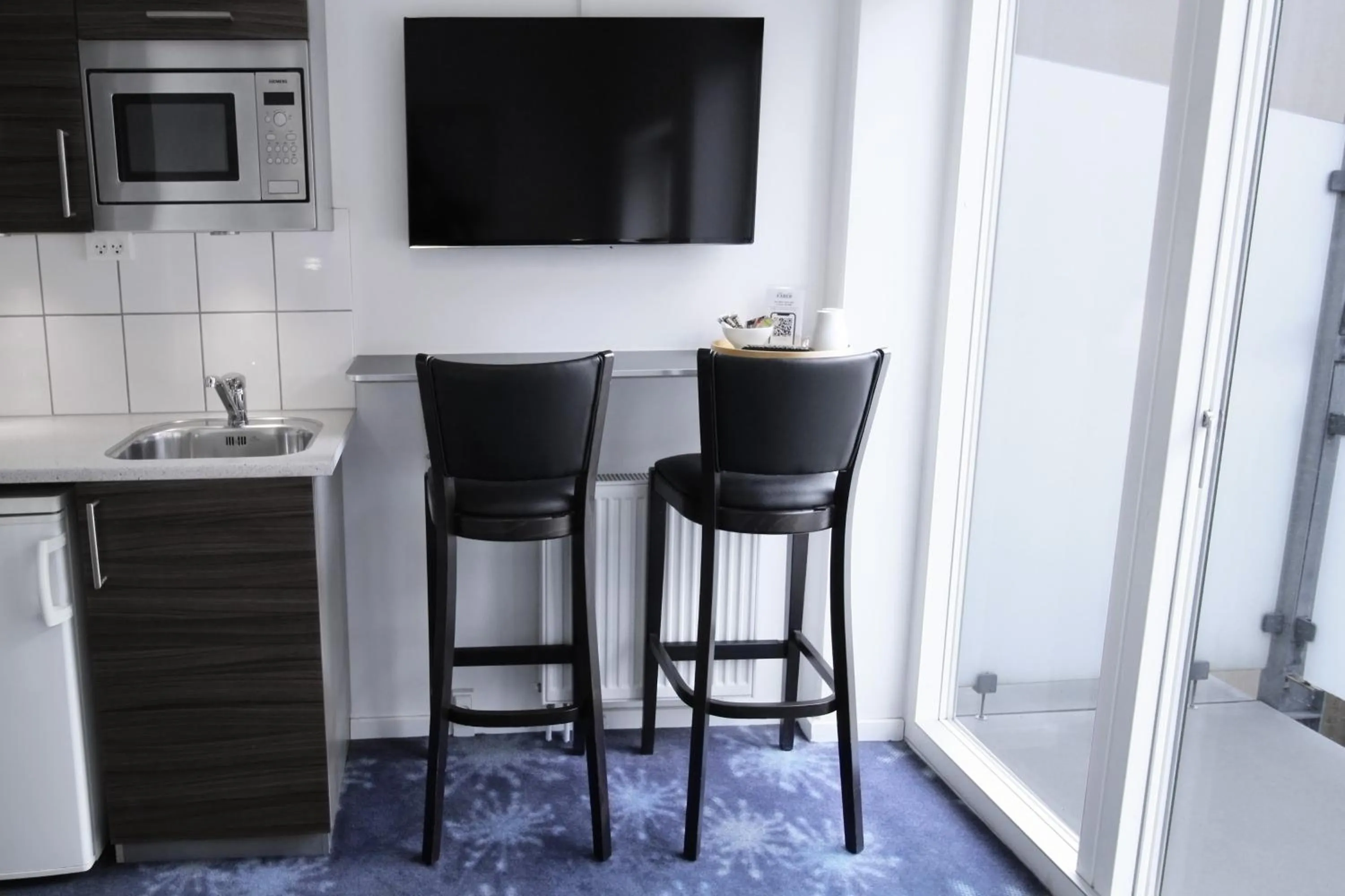 TV and multimedia in ApartHotel Faber