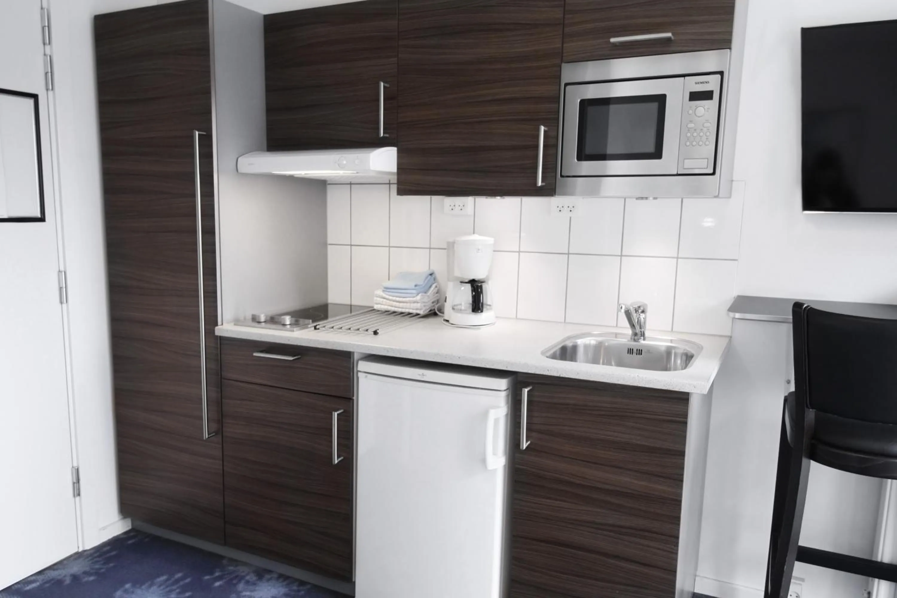 Kitchen or kitchenette in ApartHotel Faber