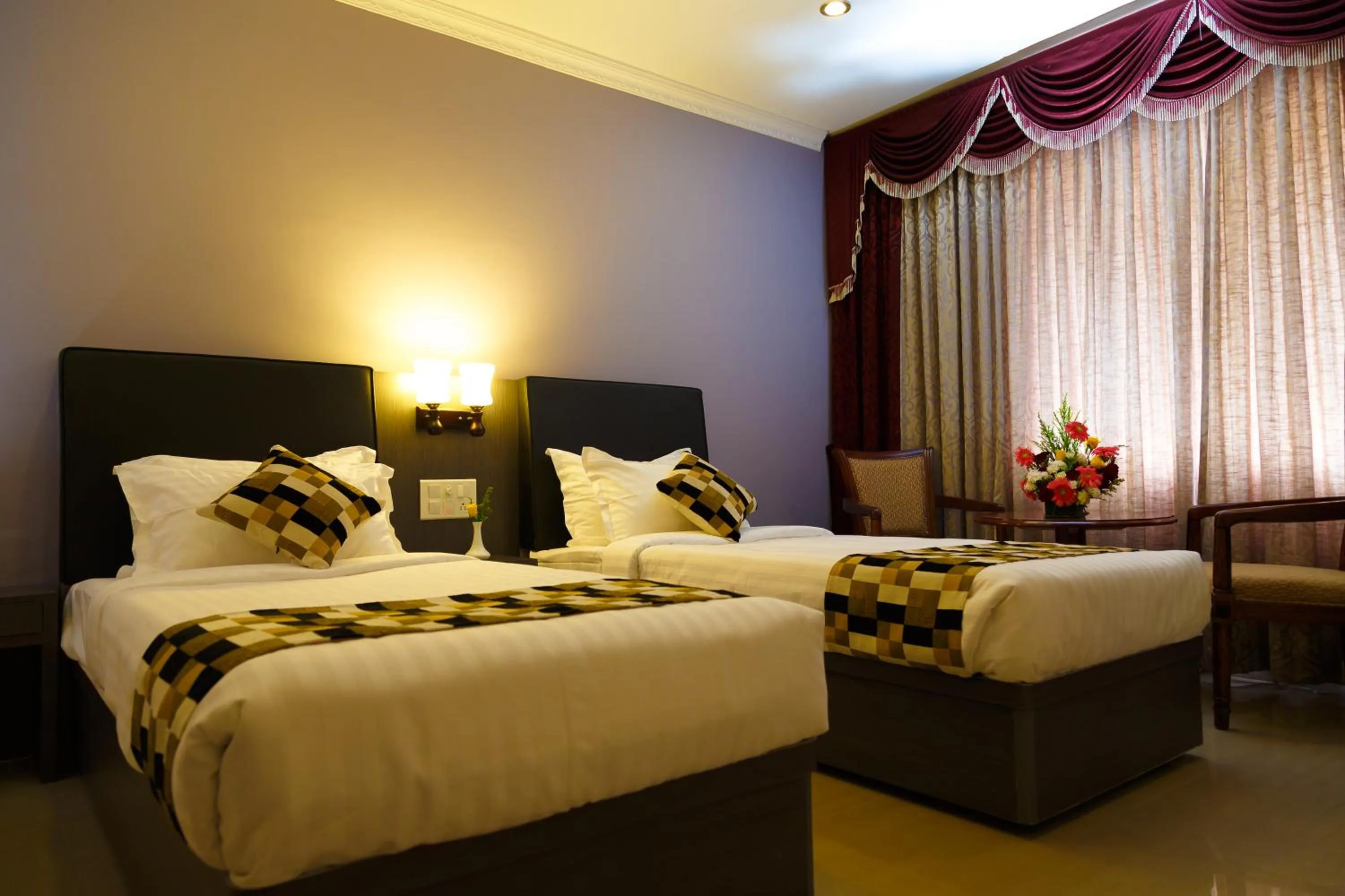 Bed in Hotel Gopalapuram International