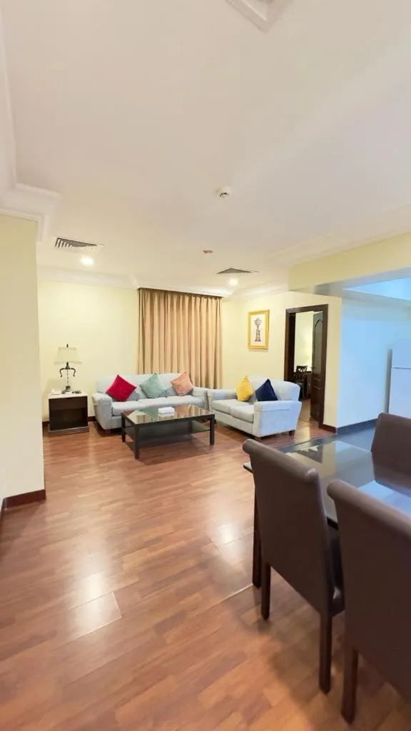 Living room, Bed in The Palace Suites