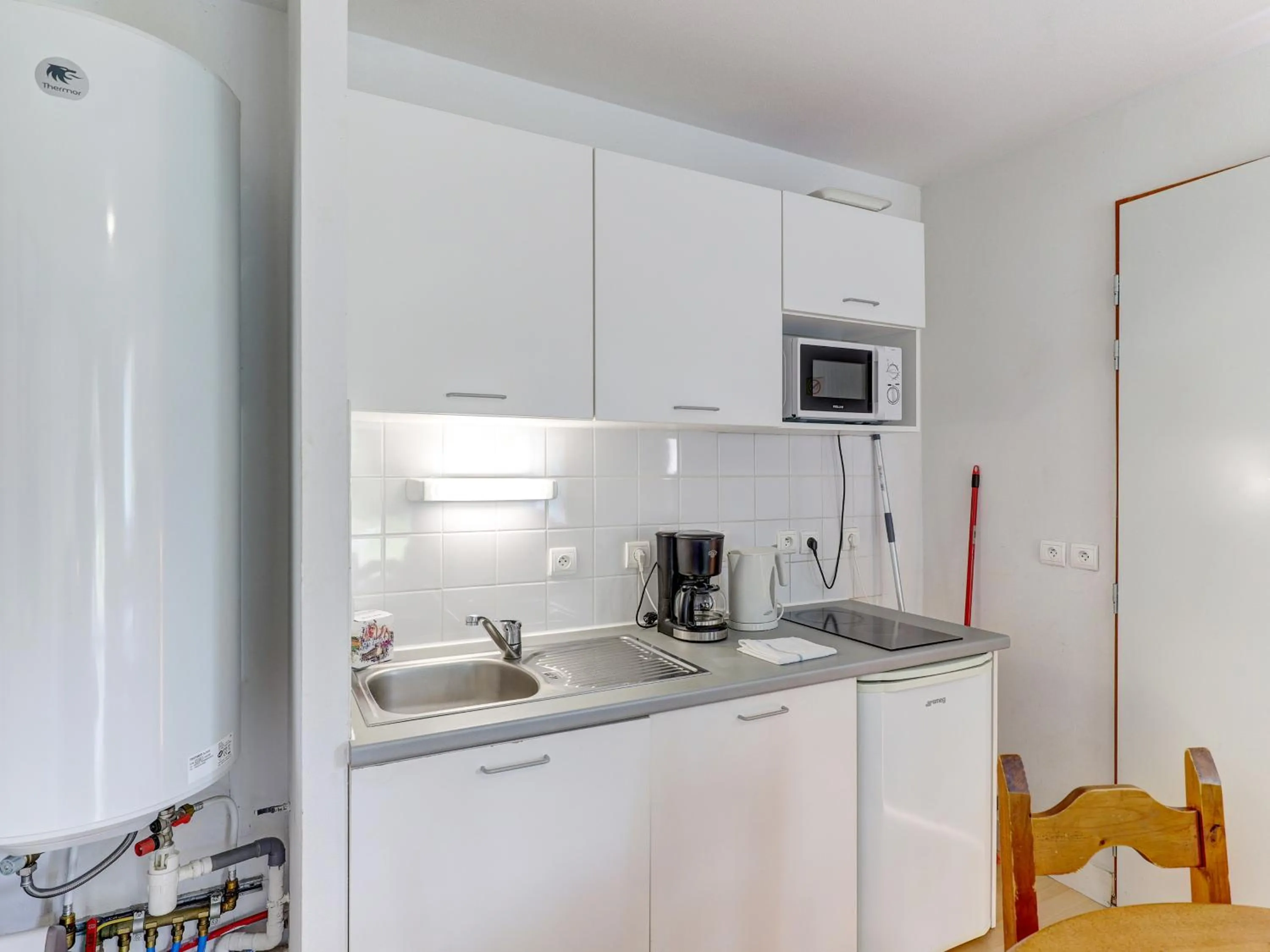 kitchen in Vacancéole - Residence le Domaine du Bosquet