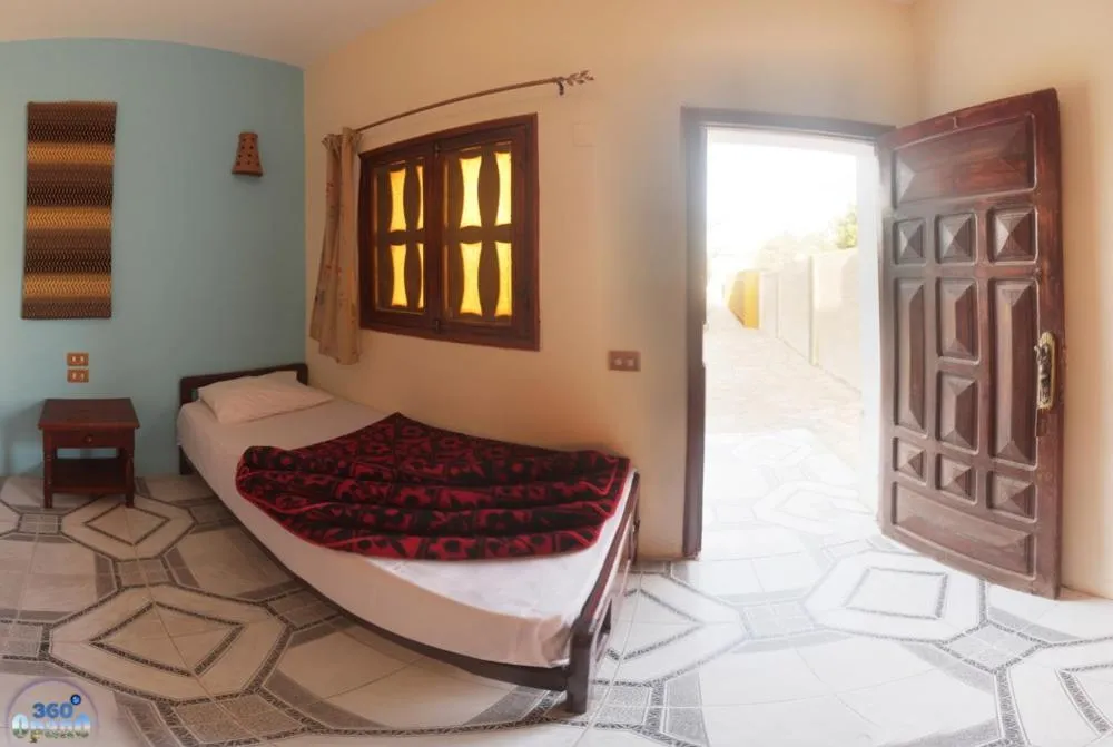 Bed in Jowhara Hotel