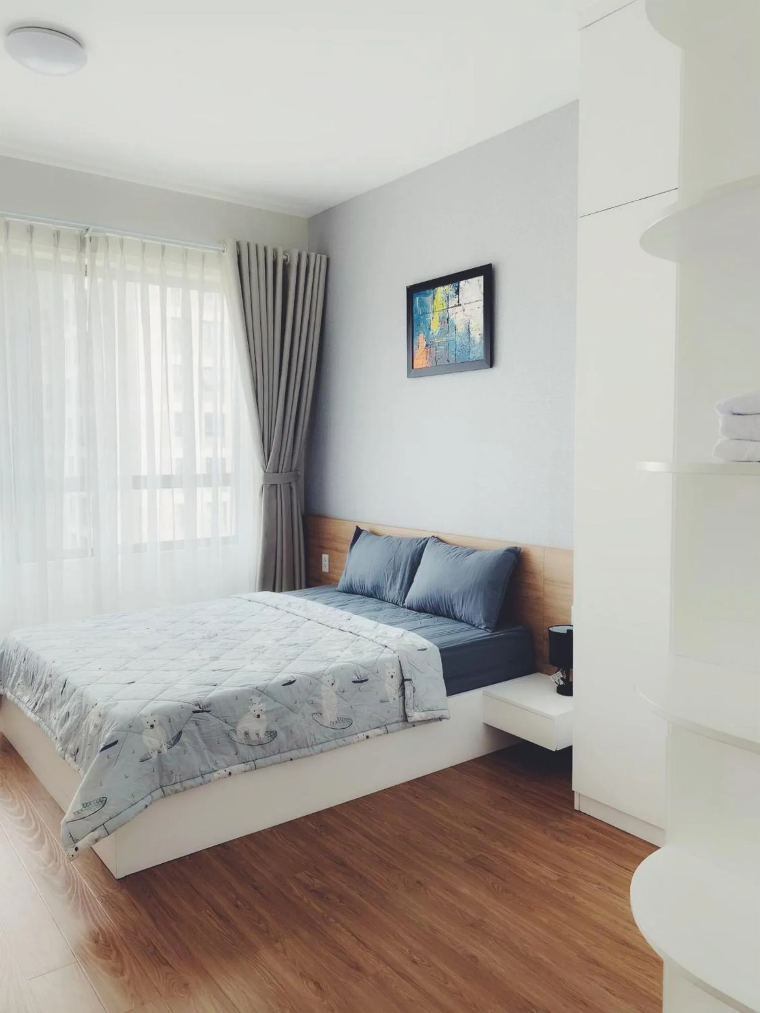 Bed in MRT Apartment In Masteri Thao Dien