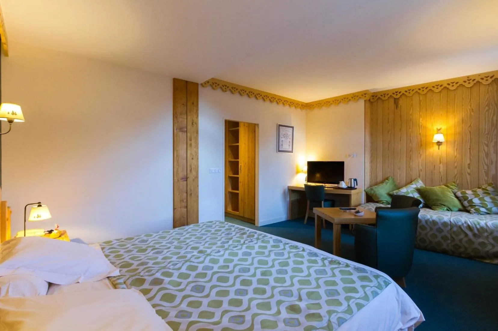 Communal lounge/ TV room, Bed in Hôtel Le Bois Joli