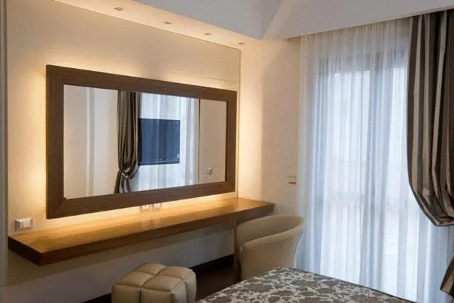 Seating area, Bed in OC Hotel