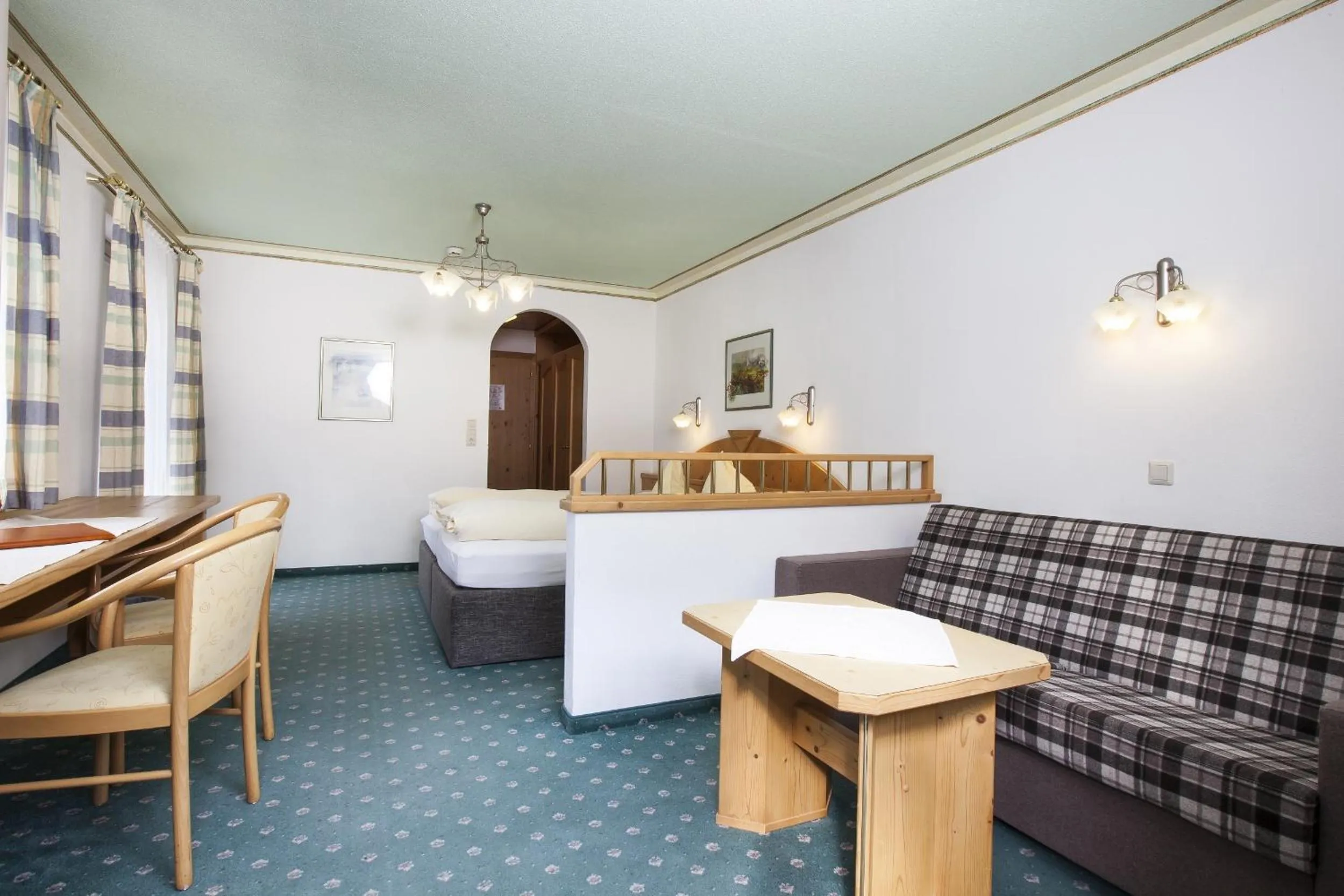 Seating area, Bed in Hotel & Appartements Alpenresidenz Viktoria