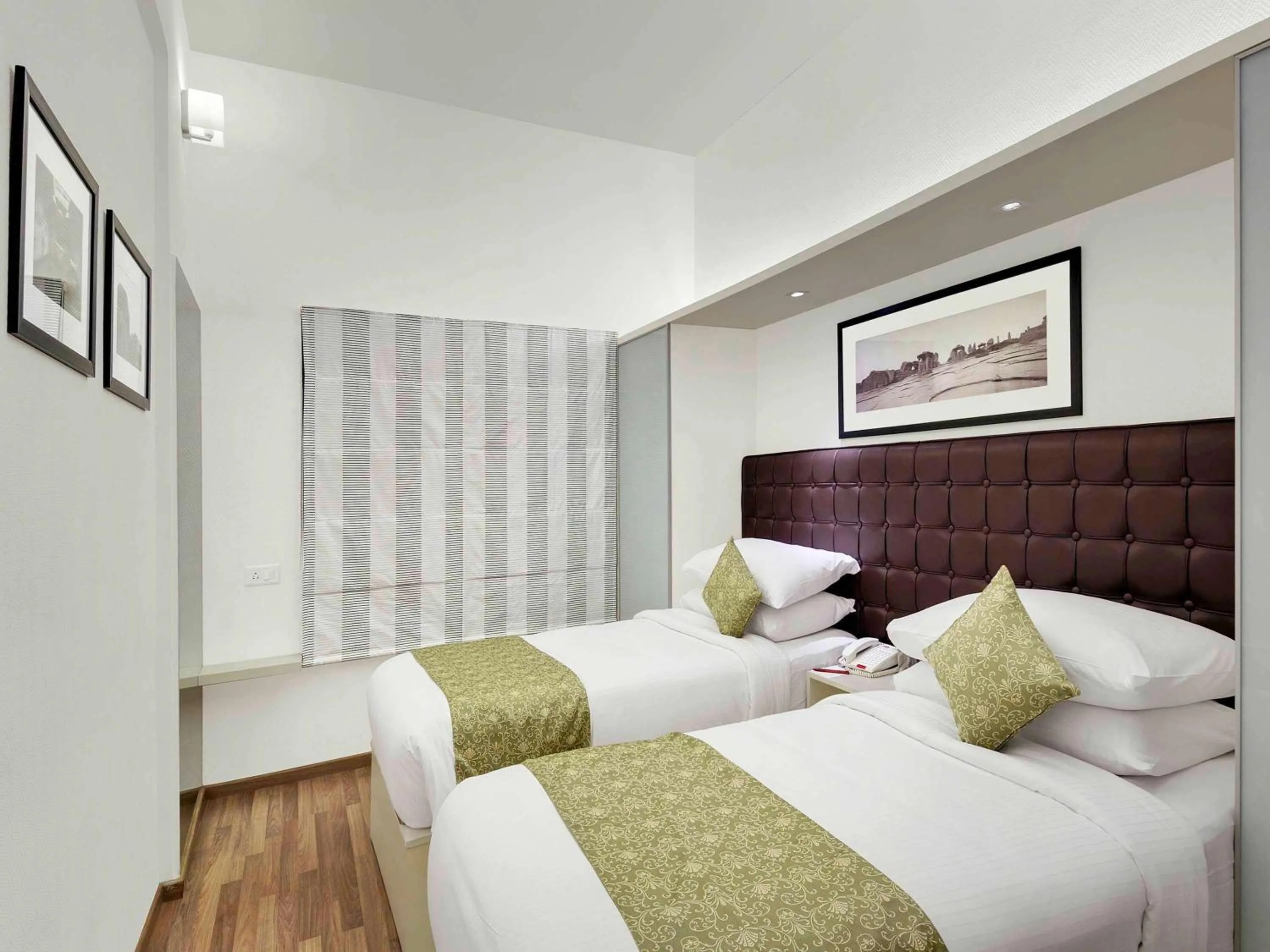 Photo of the whole room, Bed in Grand Mercure Vadodara Surya Palace