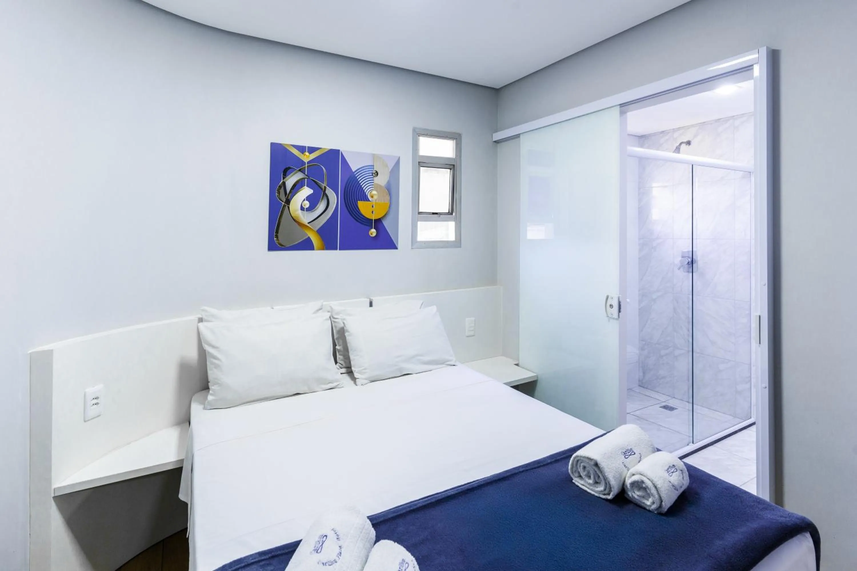 Bed in Carillon Plaza Hotel