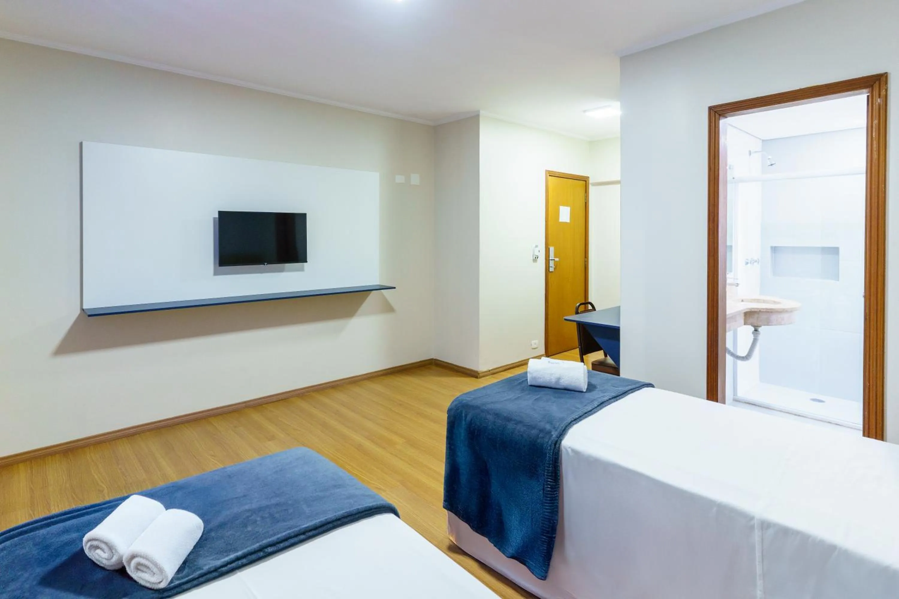 Bed in Carillon Plaza Hotel