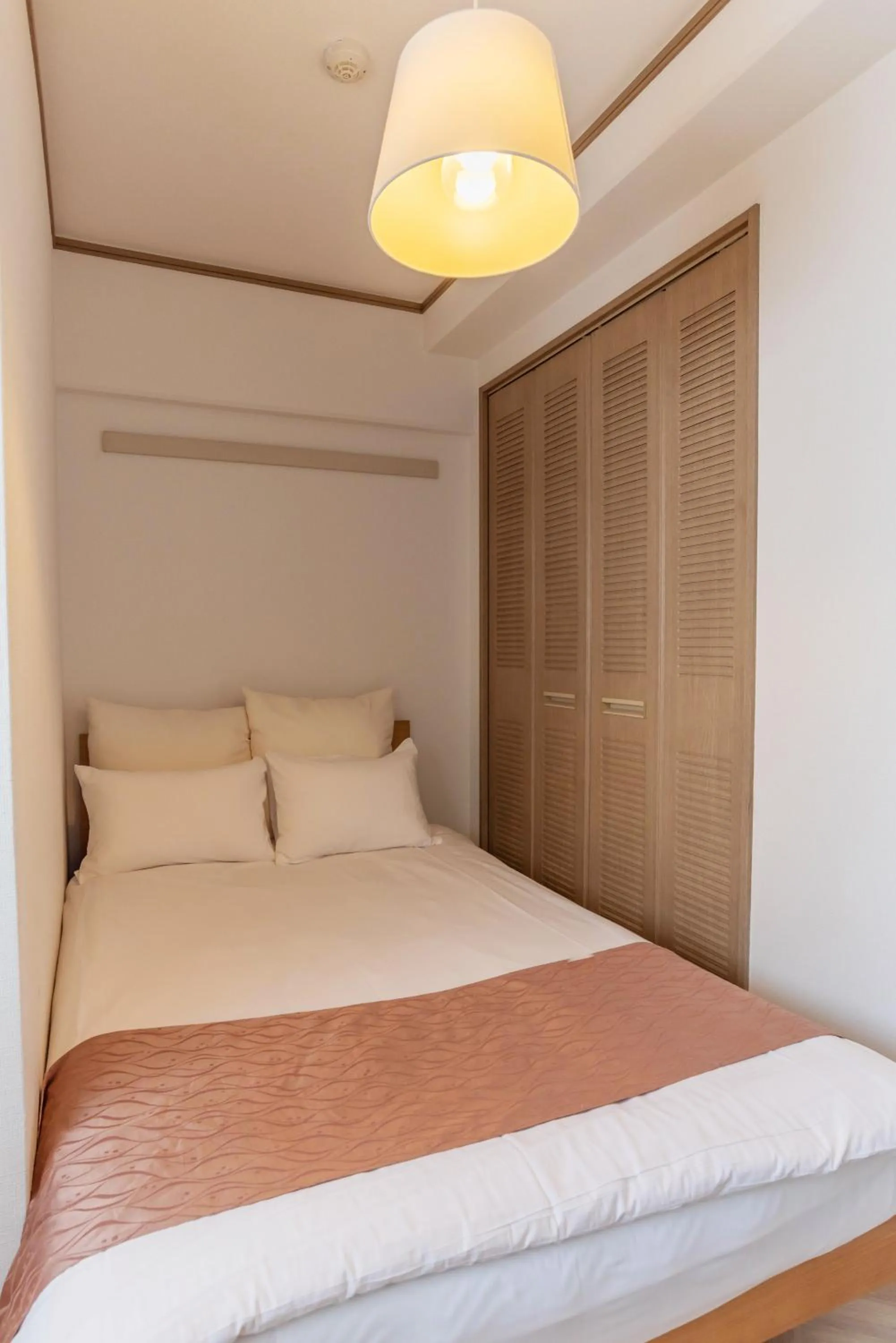 Bed in Universal Bay Condominium