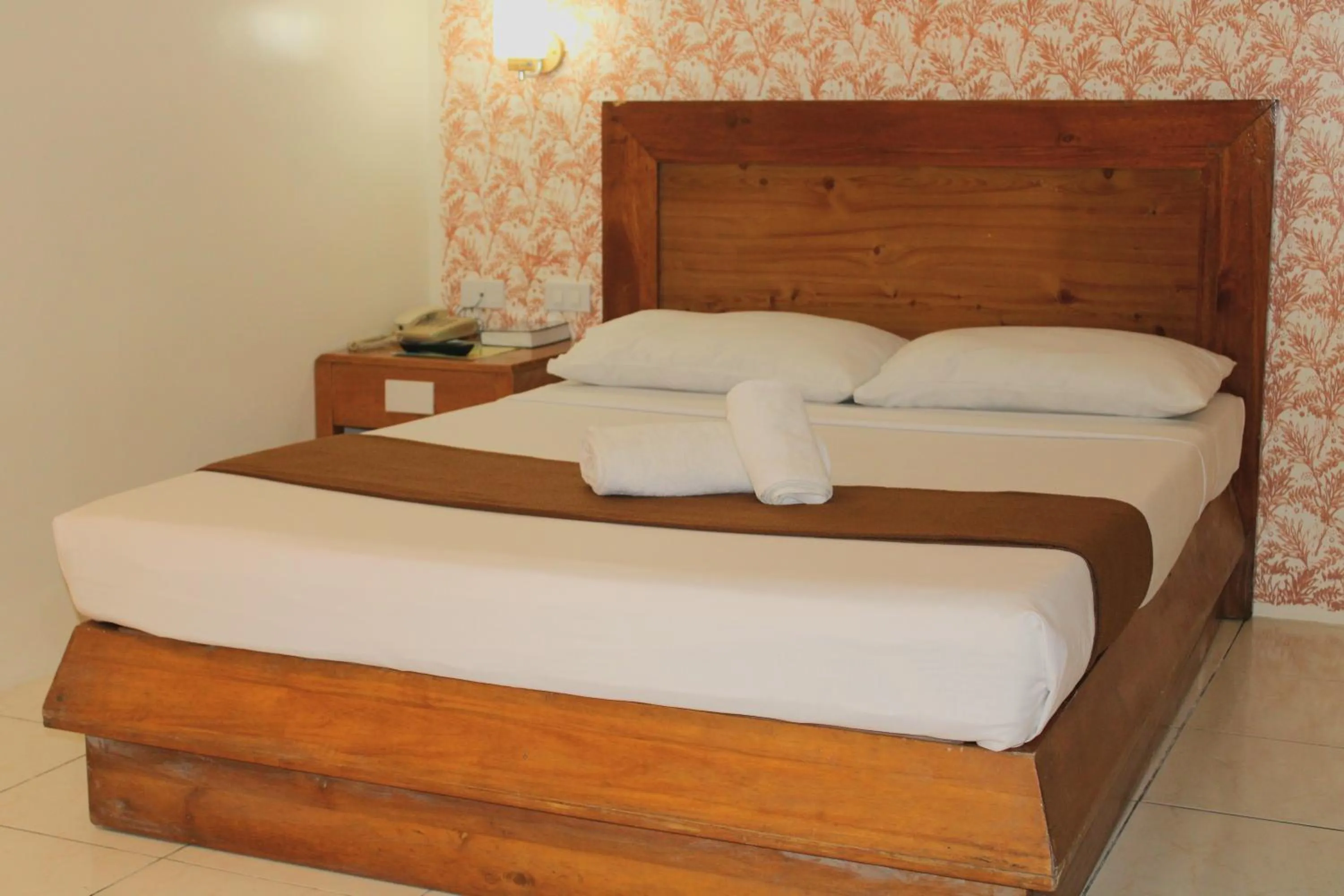 Bed in Rosas Garden Hotel