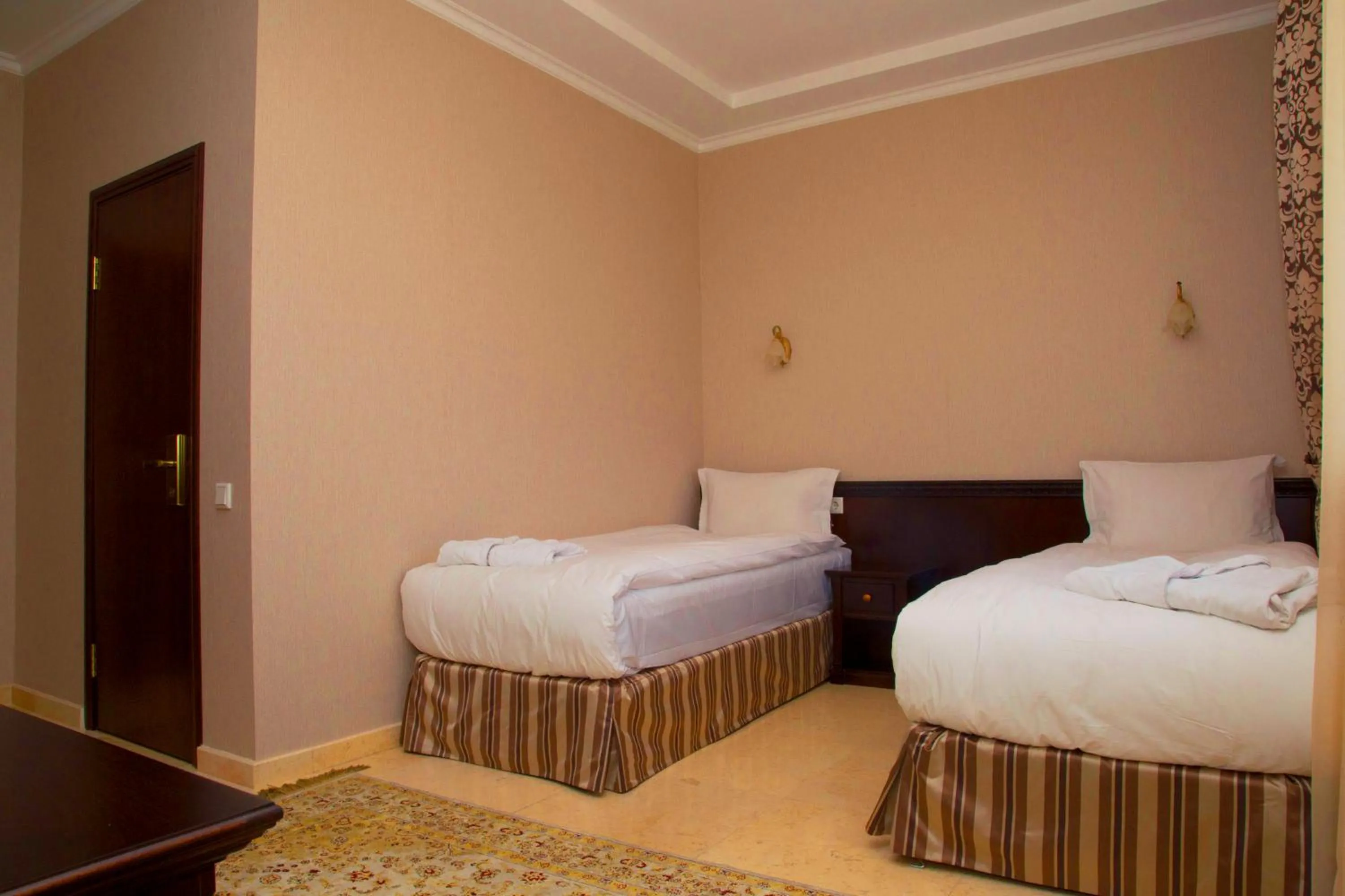 Bed in Royal Petrol Hotel