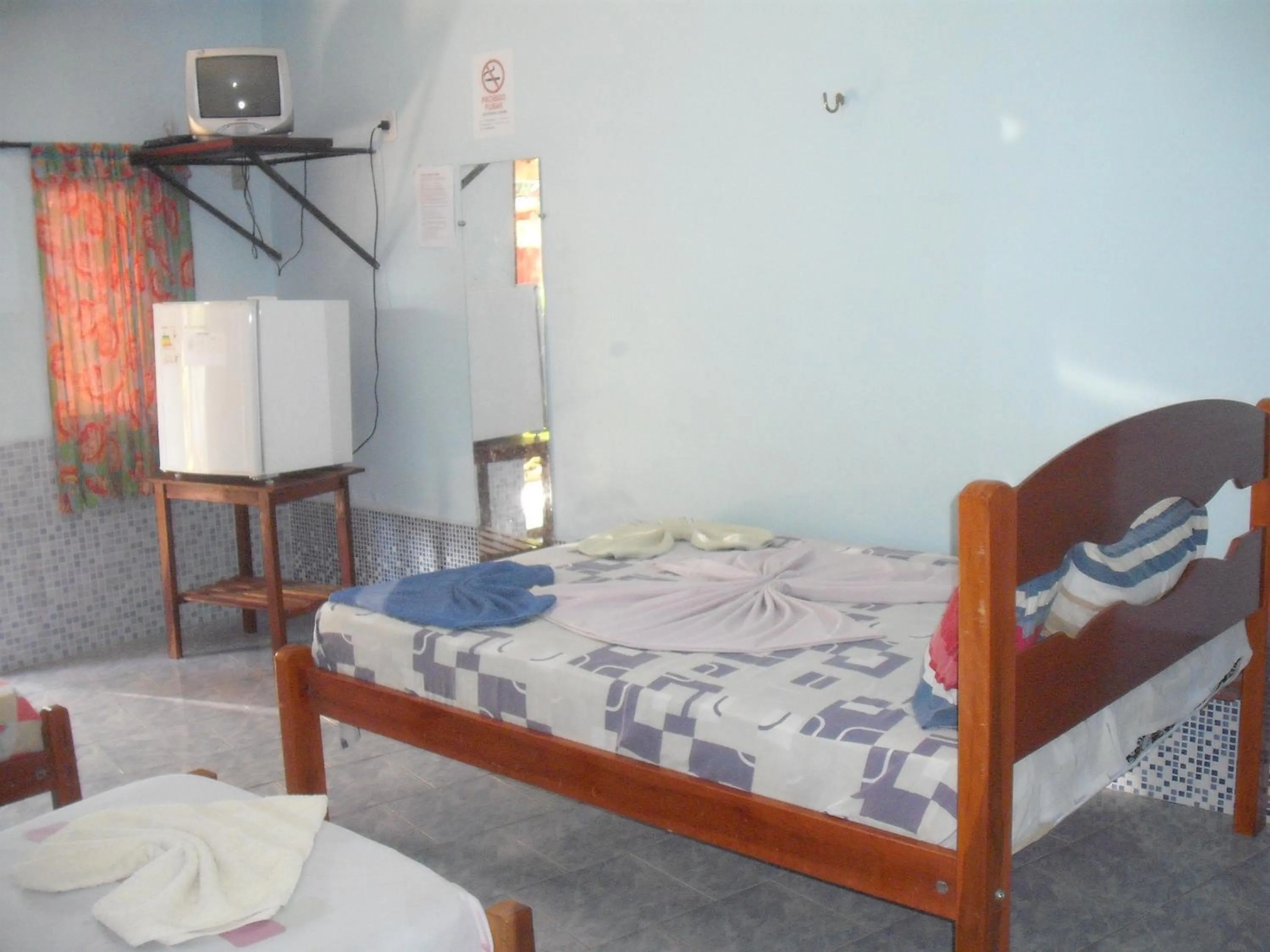Photo of the whole room, Bed in Pousada Chalé Suiço