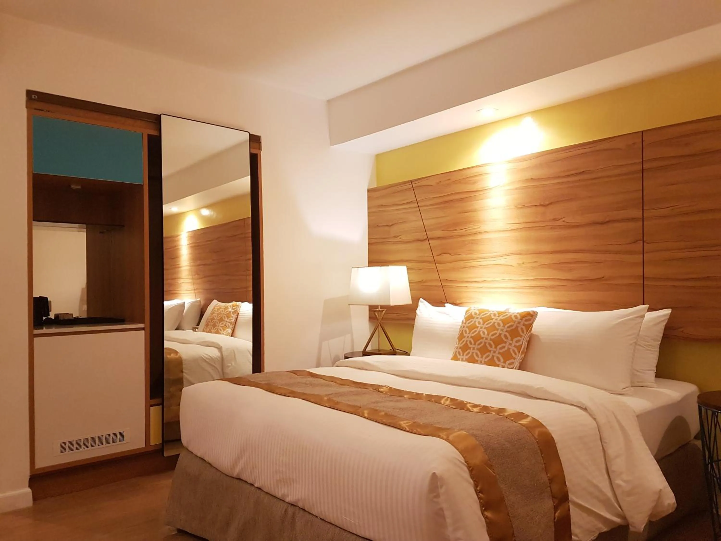 Bed in Ferra Hotel and Garden Suites