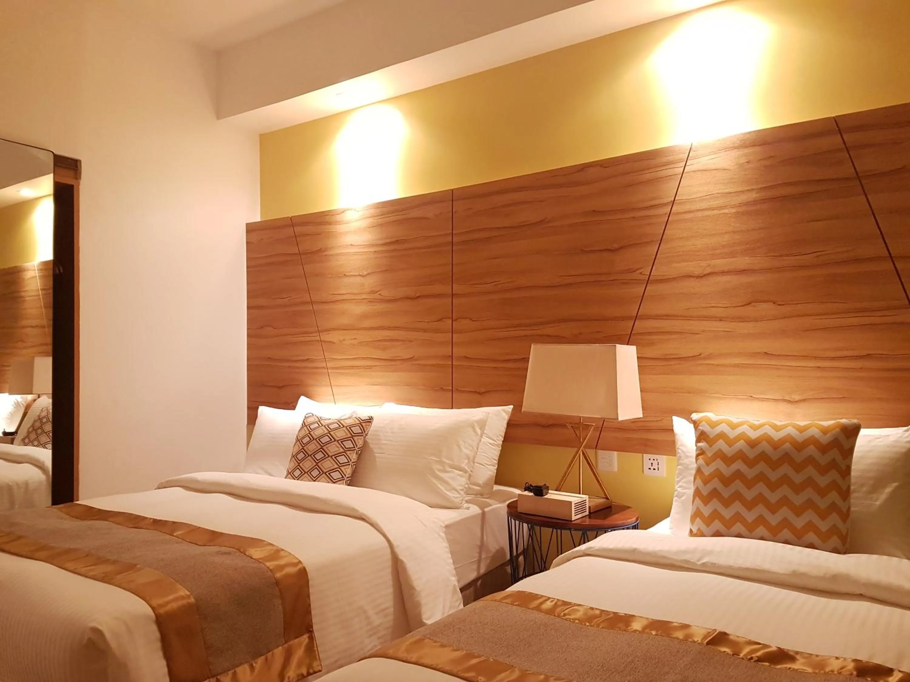 Bed in Ferra Hotel and Garden Suites