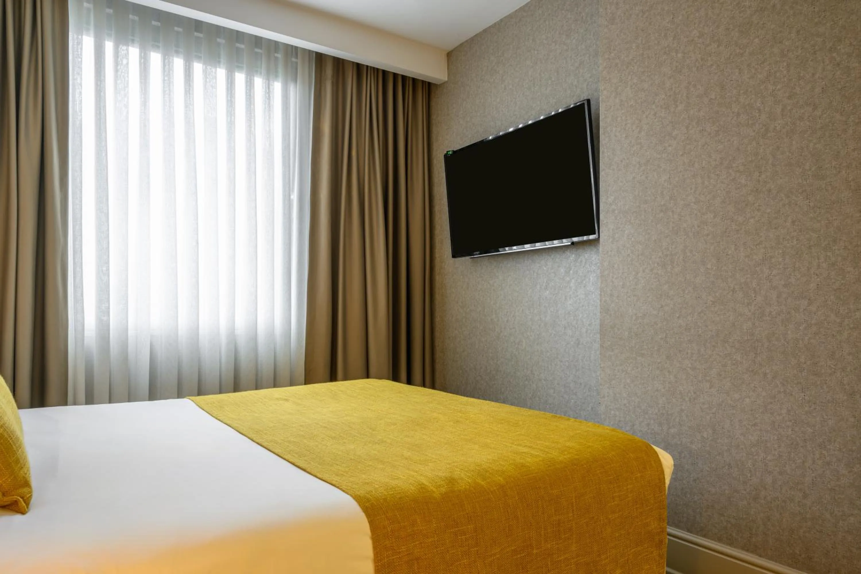 Bed in Ramada by Wyndham Istanbul Grand Bazaar